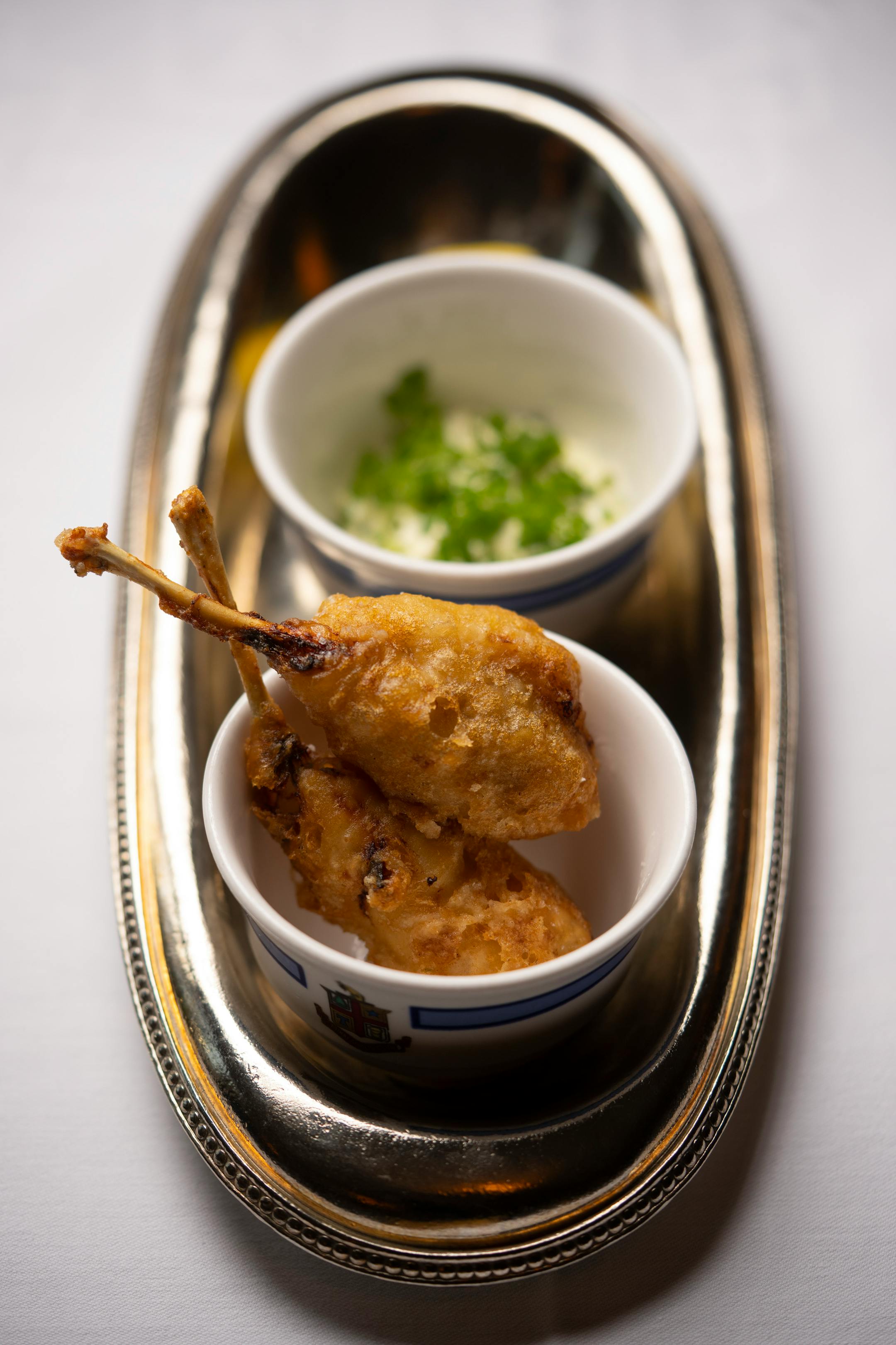 Tempura frogs legs with sauce gribiche, as prepared under the direction of chef Jamie Malone at Charlie's at the Minneapolis Club.