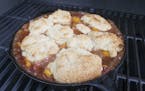 With a good grill, you can get a nice brown top on your peach cobbler biscuits.