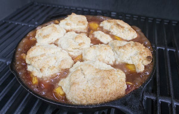With a good grill, you can get a nice brown top on your peach cobbler biscuits.