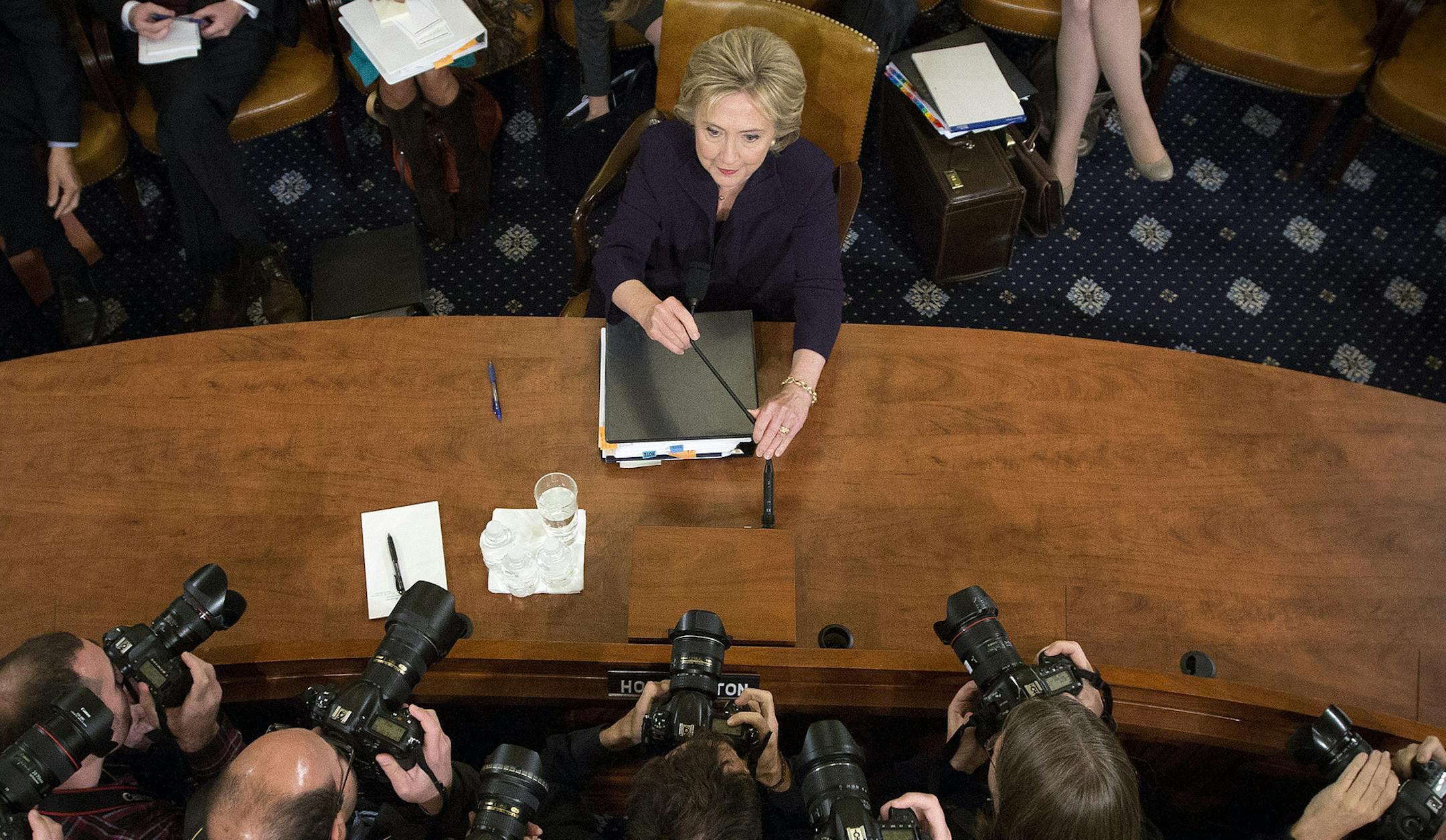 Former Secretary of State Hillary Rodham Clinton, center, while she testifies before the House Select Committee on Benghazi on Capitol Hill, in Washington, Oct. 22, 2015. Clinton confronted Republican critics on the committee Thursday with a challenge to &#xec;reach for statesmanship&#xee; in their long-running inquiry into the 2012 attacks that killed four Americans. (Doug Mills/The New York Times) ORG XMIT: MIN2015102315464665