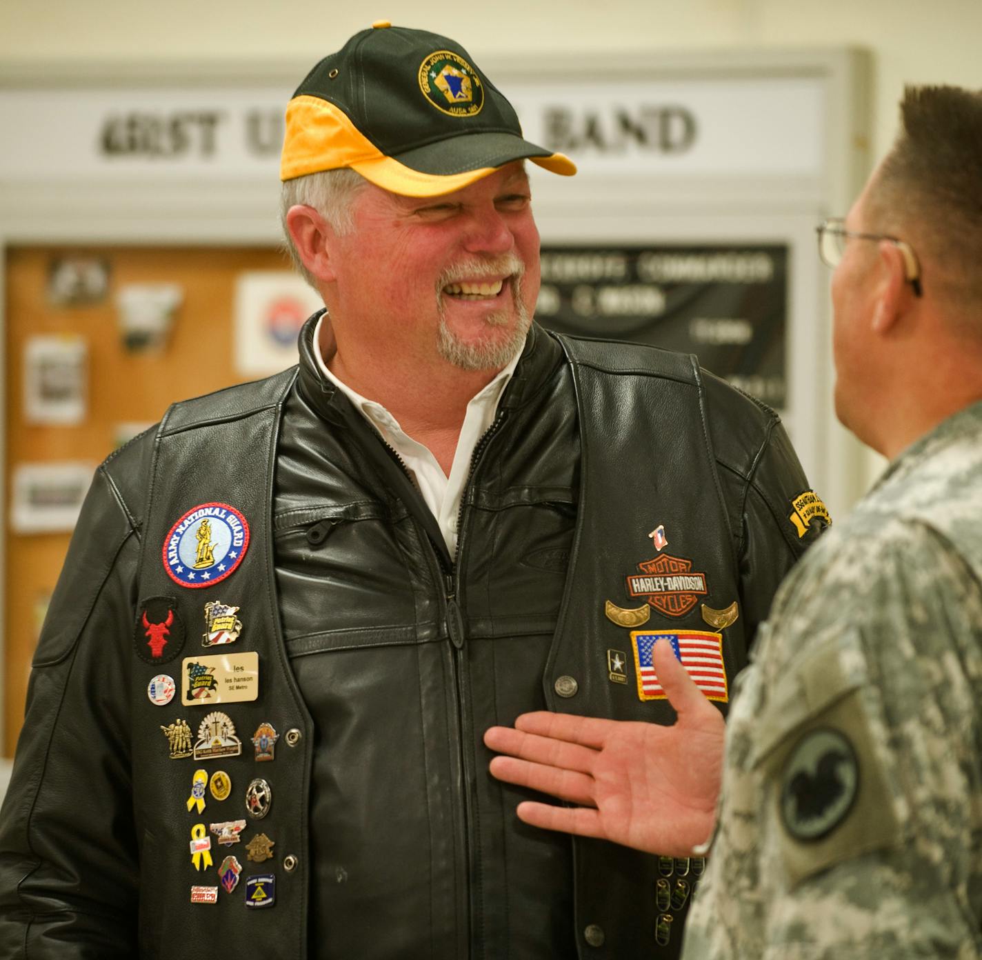 DAVID BREWSTER � dbrewster@startribune.com Sunday_12/07/08_Minneapolis Les Hanson is Vietman vet who wanted to re-enlist after 9/11. That didn't happen, but starting seven years ago, he began overseeing Christmas parties for military kids across the state. Seen here talking to Command Sgt.Major John Vacho of the 88th Regional Readiness Command.