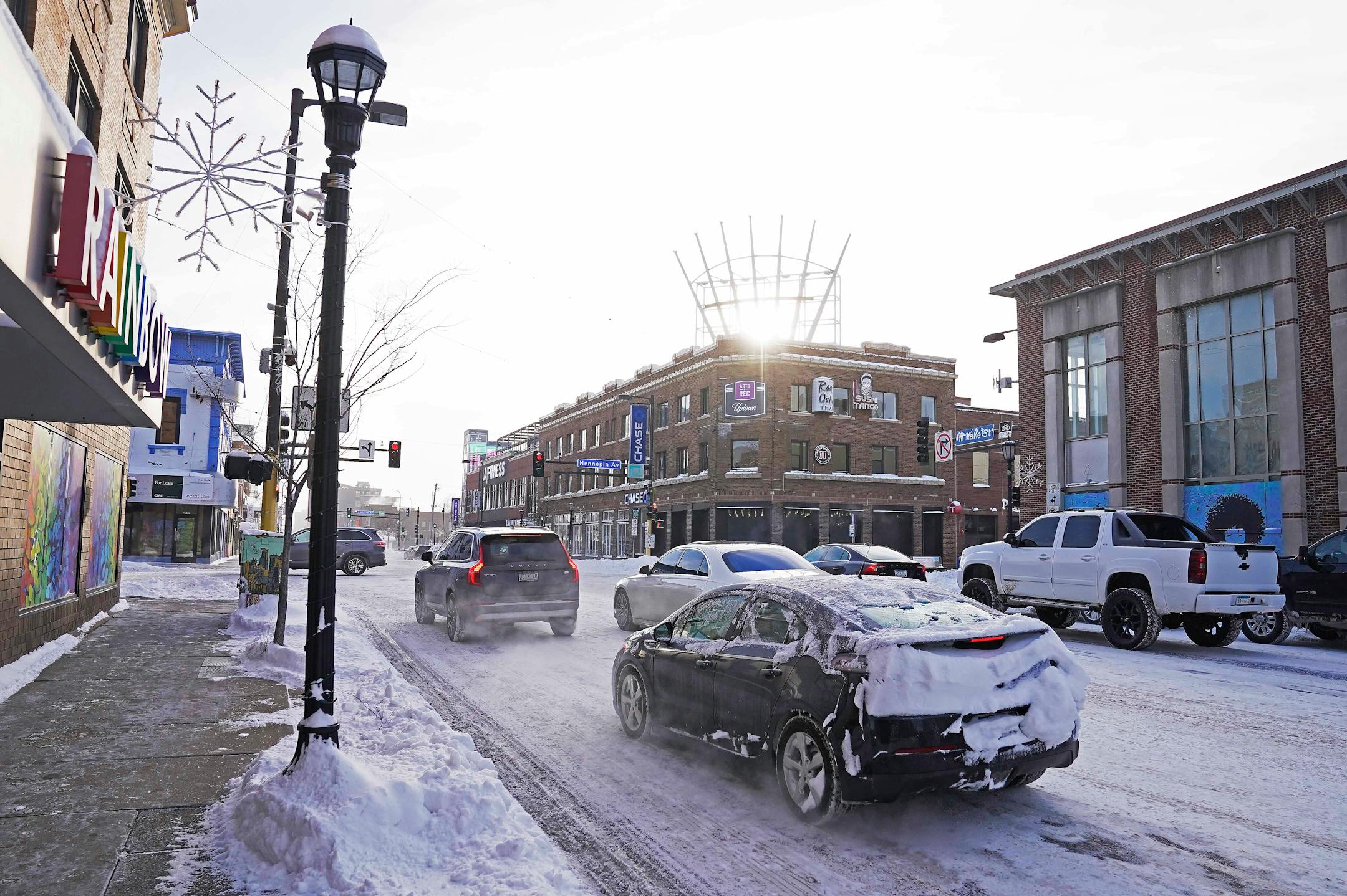 The historic Rainbow Building, left, and former Calhoun Square in Uptown at Hennepin and Lake, Feb. 24, 2023, in Minneapolis, Minn. For the last decade, Uptown has been known as the place for flashy bars and restaurants but an exodus of national retailers followed by the impacts of the pandemic and civil unrest has changed that and stakeholders believe that the next evolution of Uptown is going to be more service-driven retail think laundry and dentist offices to help support people living in the neighborhood.