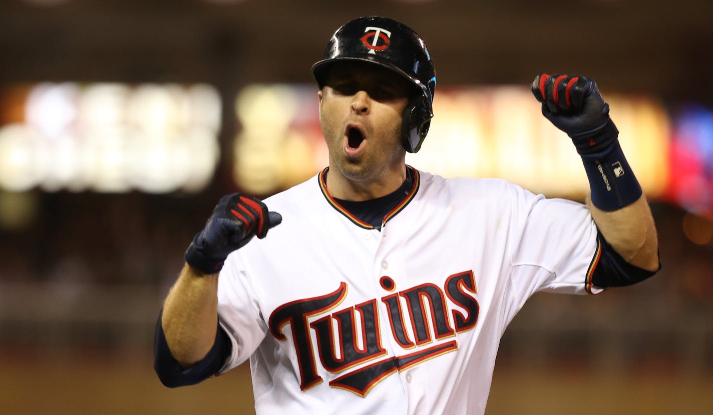 Twins Brian Dozier celebrated his walk off home run heading to first. Dozier's home run made the Twins an 8-6 winner over Detroit at Target Field in Minneapolis.
KYNDELL HARKNESS/kharkness@startribune.com