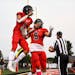 Shakopee quarterback Dominic Jackson (1) and running back Jadon Hellerud (5) celebrated a rushing touchdown by Jackson in the first quarter against Pr