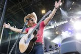Dustin Lynch performs first during the Luke Bryan Kick The Dust Up Tour at TCF Bank Stadium in Minneapolis June 20, 2015. (Courtney Perry/Special to the Star Tribune)