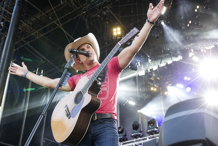 Dustin Lynch performs first during the Luke Bryan Kick The Dust Up Tour at TCF Bank Stadium in Minneapolis June 20, 2015. (Courtney Perry/Special to the Star Tribune)