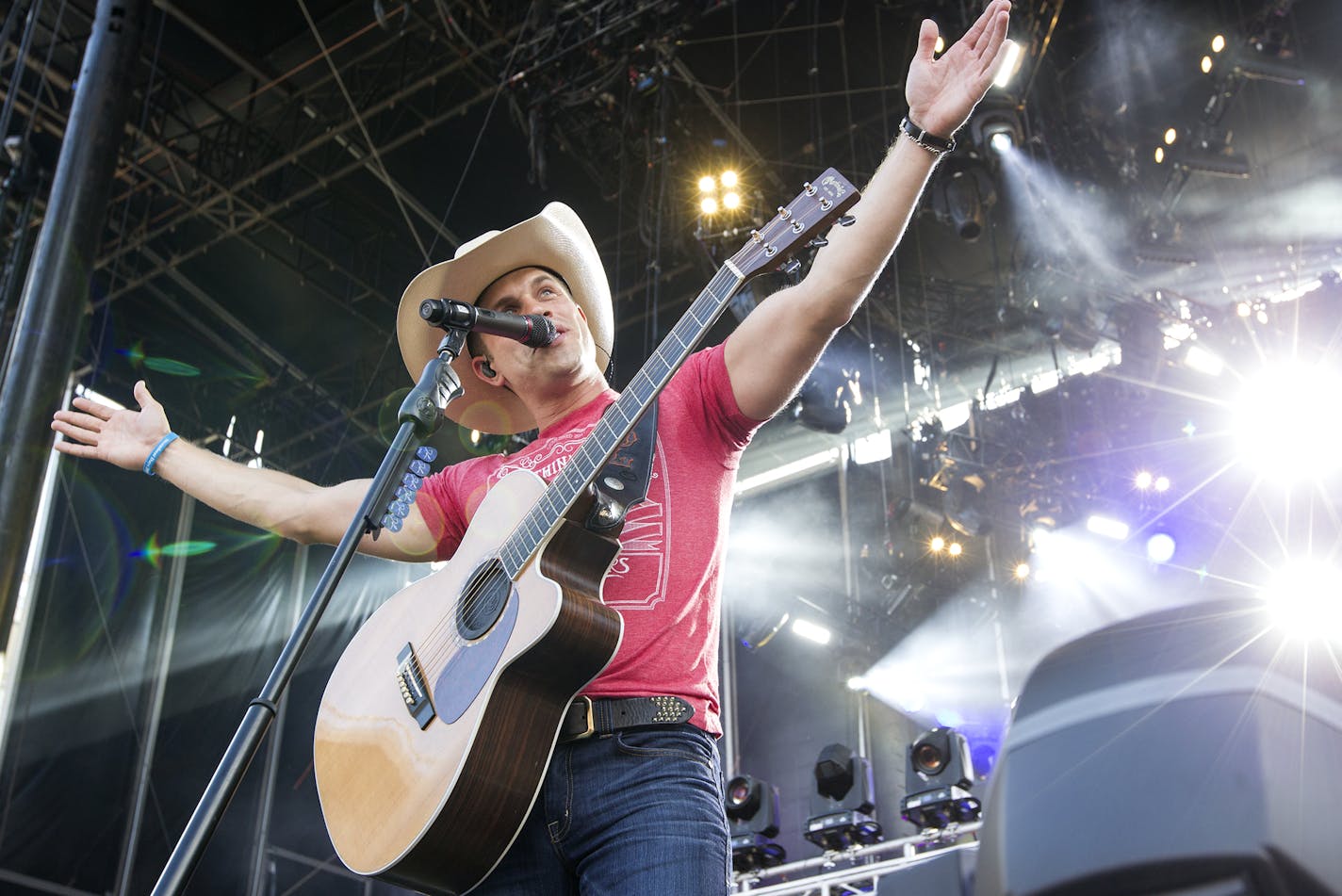 Dustin Lynch performs first during the Luke Bryan Kick The Dust Up Tour at TCF Bank Stadium in Minneapolis June 20, 2015. (Courtney Perry/Special to the Star Tribune)