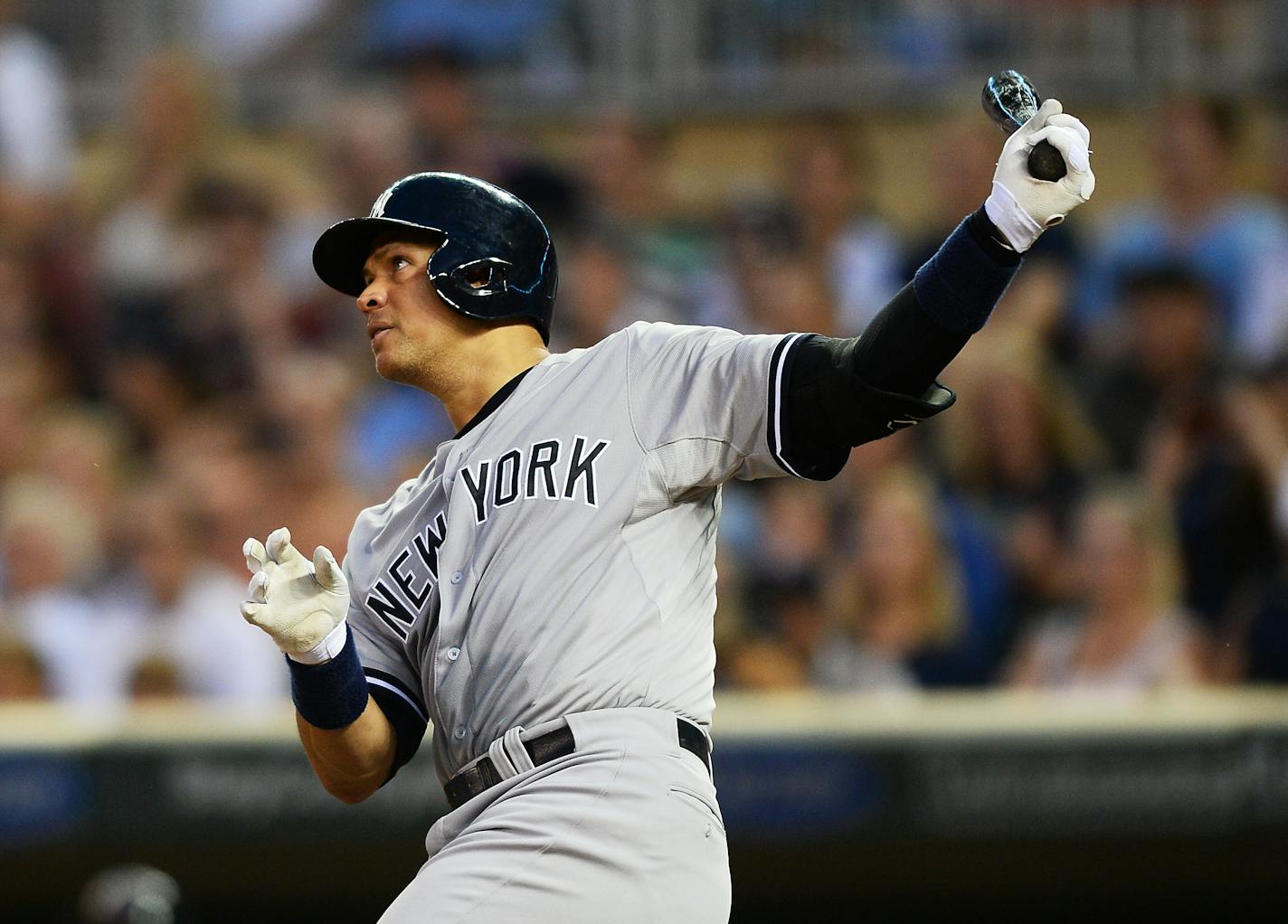 Alex Rodriguez followed through with his swing after hitting his third home run of the night in the top of the ninth against the Twins on Saturday night.