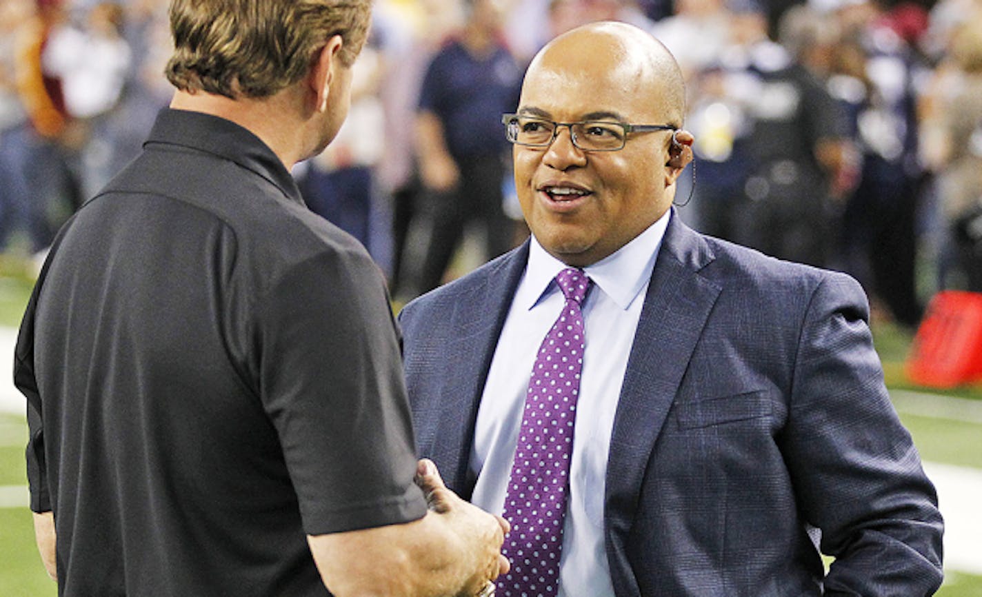 ESPN announcer Mike Tirico before an NFL football game between the Dallas Cowboys against the Washington Redskins on Monday, October 27, 2014 at AT&T Stadium in Arlington, Texas.  The Redskins defeated the Cowboys in overtime, 20-17. (AP Photo/James D Smith)