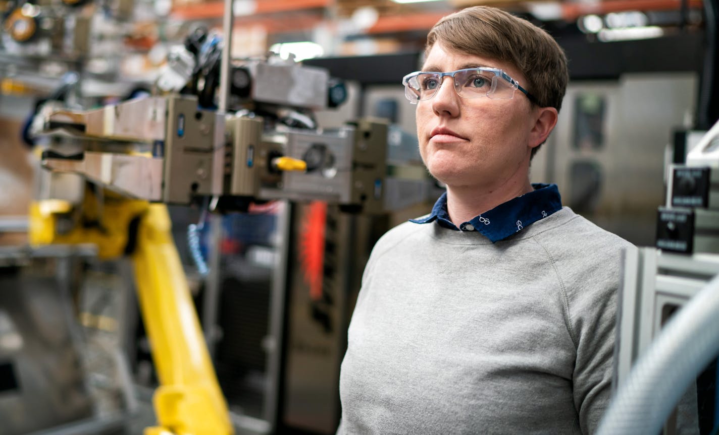 Kim Wieting writes code for the operating robots at Graco. ] GLEN STUBBE &#x2022; glen.stubbe@startribune.com Thursday, February 14, 2019 Graco, Dunwoody College & Fanuc team up to teach people to completely automate assembly lines with new robots. Graco added 24 robots in last few years. Two more robots arrive in two weeks. The robots (xome $1 million) are the answer to a hiring shortage that has caused product delays to customers. Need pix of Randy Barcus & employees w/ robotic manufacturing c