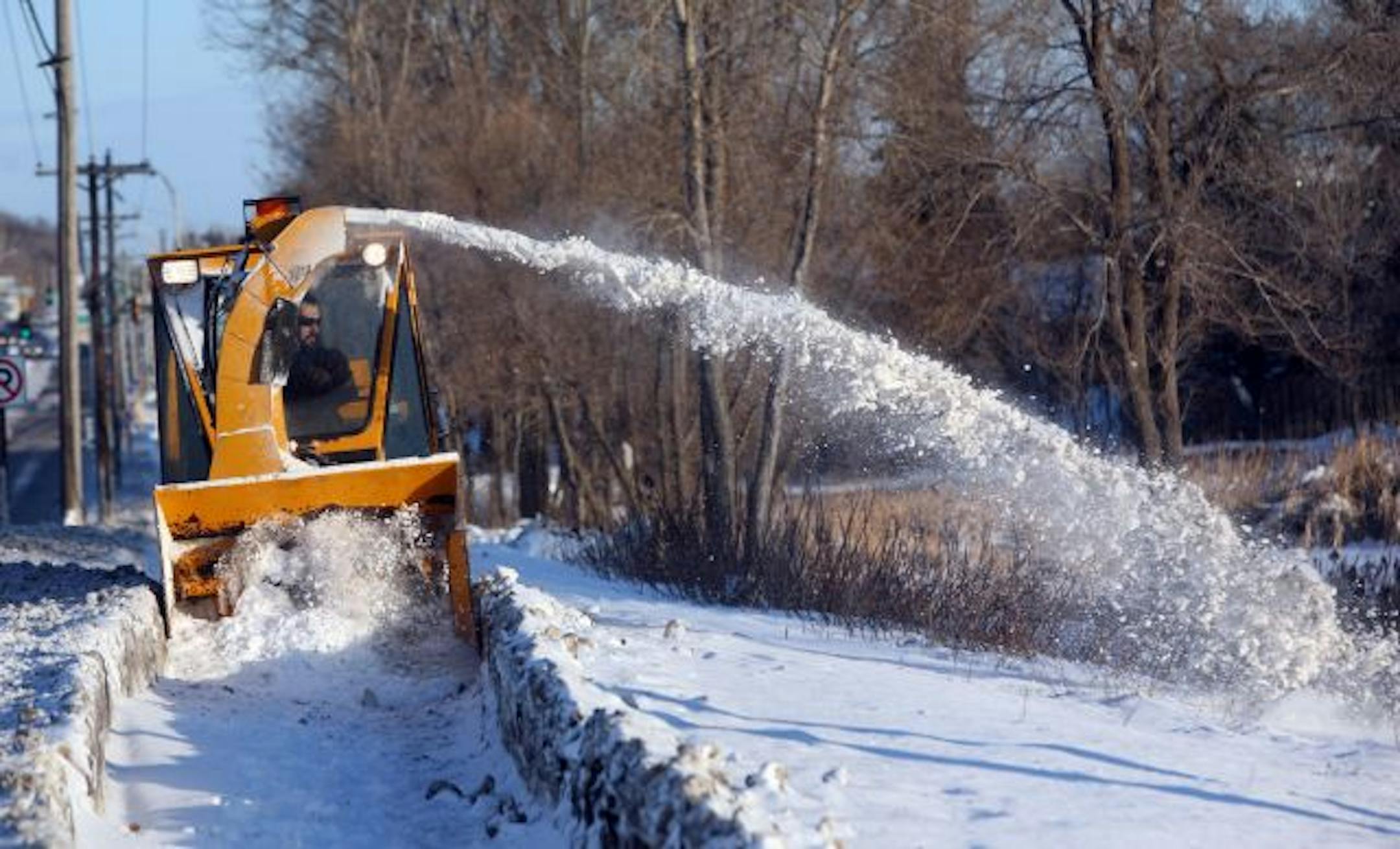 Shoreview city worker Eric Rydeen cleared snow off a sidewalk on Lexington Avenue last week. Shoreview crews have always cleared city sidewalks and will continue to do so, officials say, to promote walkability and public safety.
