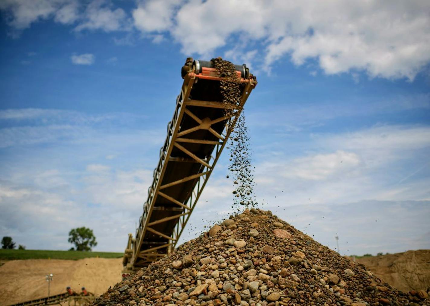 Sand and gravel is scooped up by a front loader, sorted, washed and distributed by Dakota Aggregates in Rosemount.