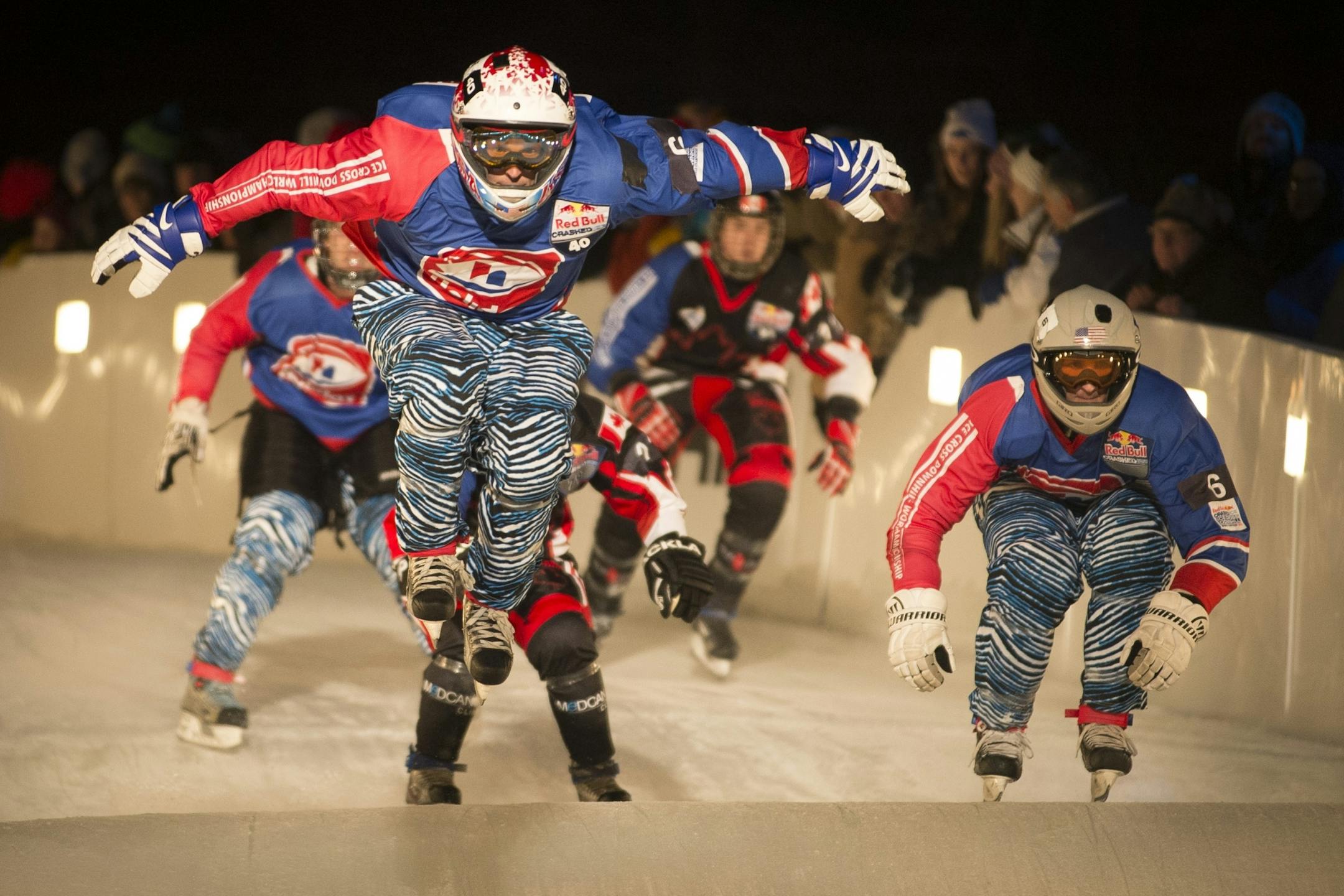 Daniel Bergeson left, with Team Murica , catches some air while racing against Team Quebec in the semifinals of the Crashed Ice team competition in January 2015.