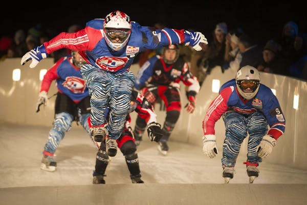 Daniel Bergeson left, with Team Murica , catches some air while racing against Team Quebec in the semifinals of the Crashed Ice team competition in Ja