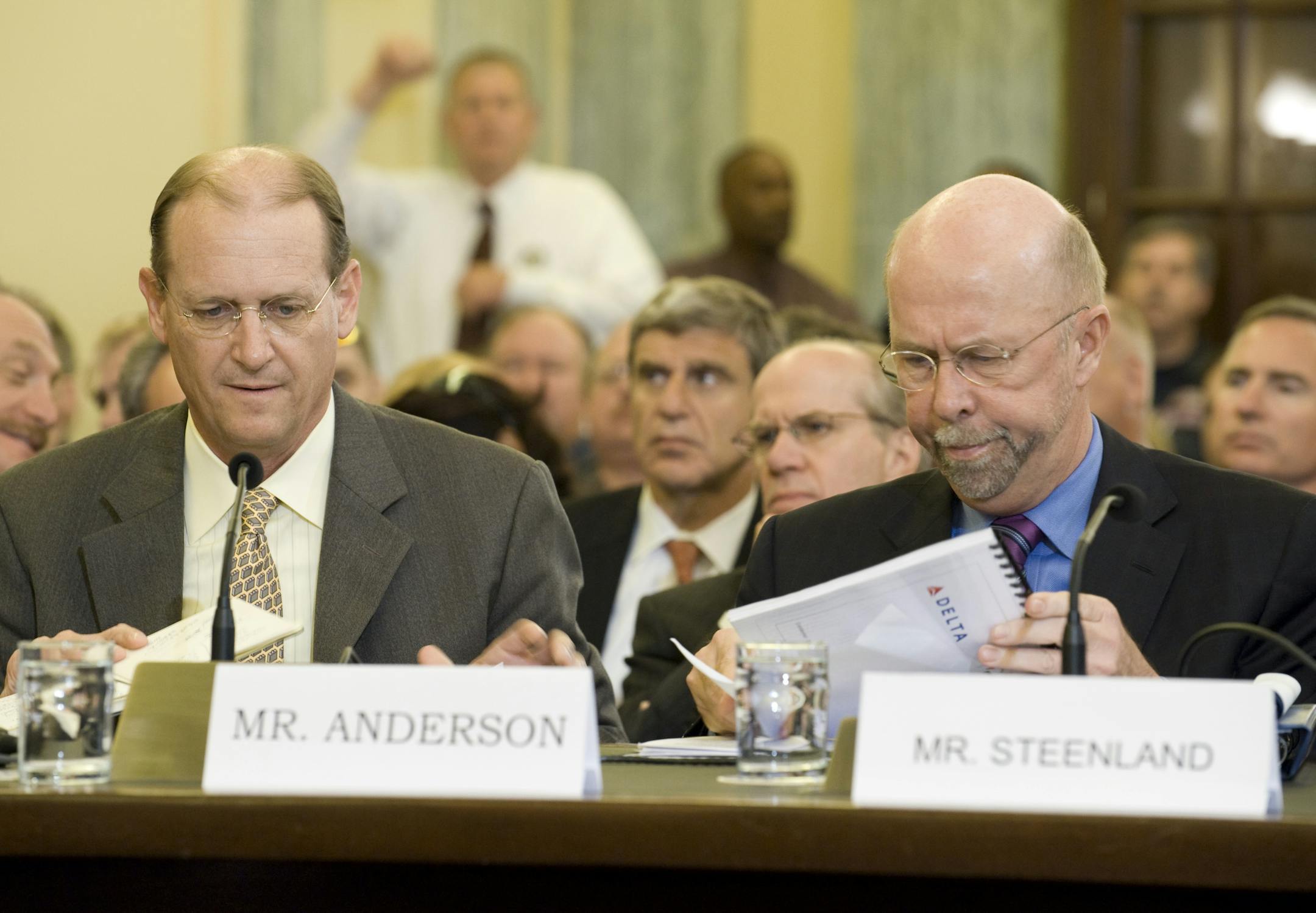 Delta Airlines CEO Richard Anderson, left, and his Northwest counterpart Doug Steenland prepare to testify at a Senate Aviation Operations, Safety and Security subcommittee hearing on the effect of the proposed merger of the two airlines.