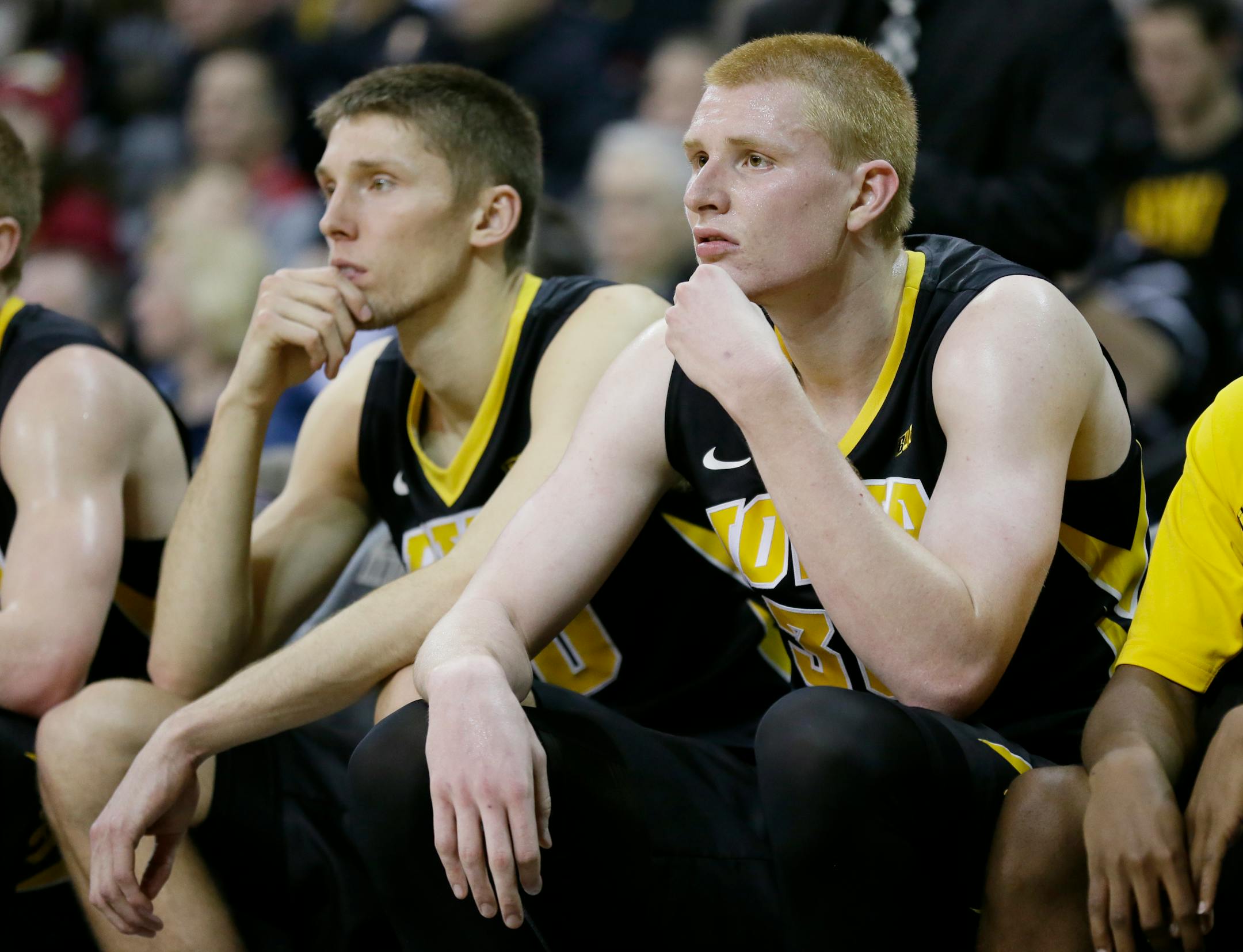 Iowa's Aaron White, right, and Jarrod Uthoff, left, sit on the bench during the second half of an NCAA college basketball game against Iowa State, Friday, Dec. 12, 2014, in Iowa City, Iowa. Iowa State won 90-75. (AP Photo/Charlie Neibergall)