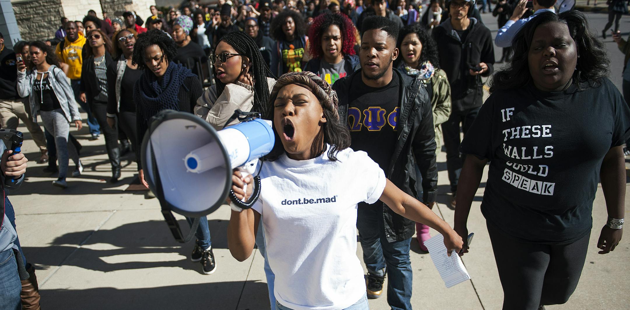 Concerned Student 1950 member Ayanna Poole uses a megaphone while leading a "We Are Not Afraid" march including local and regional campuses Friday, Nov. 13, 2015 on Rollins Street on the University of Missouri campus in Columbia, Mo. (Daniel Brenner/Columbia Daily Tribune via AP) MANDATORY CREDIT ORG XMIT: MIN2015120316202128