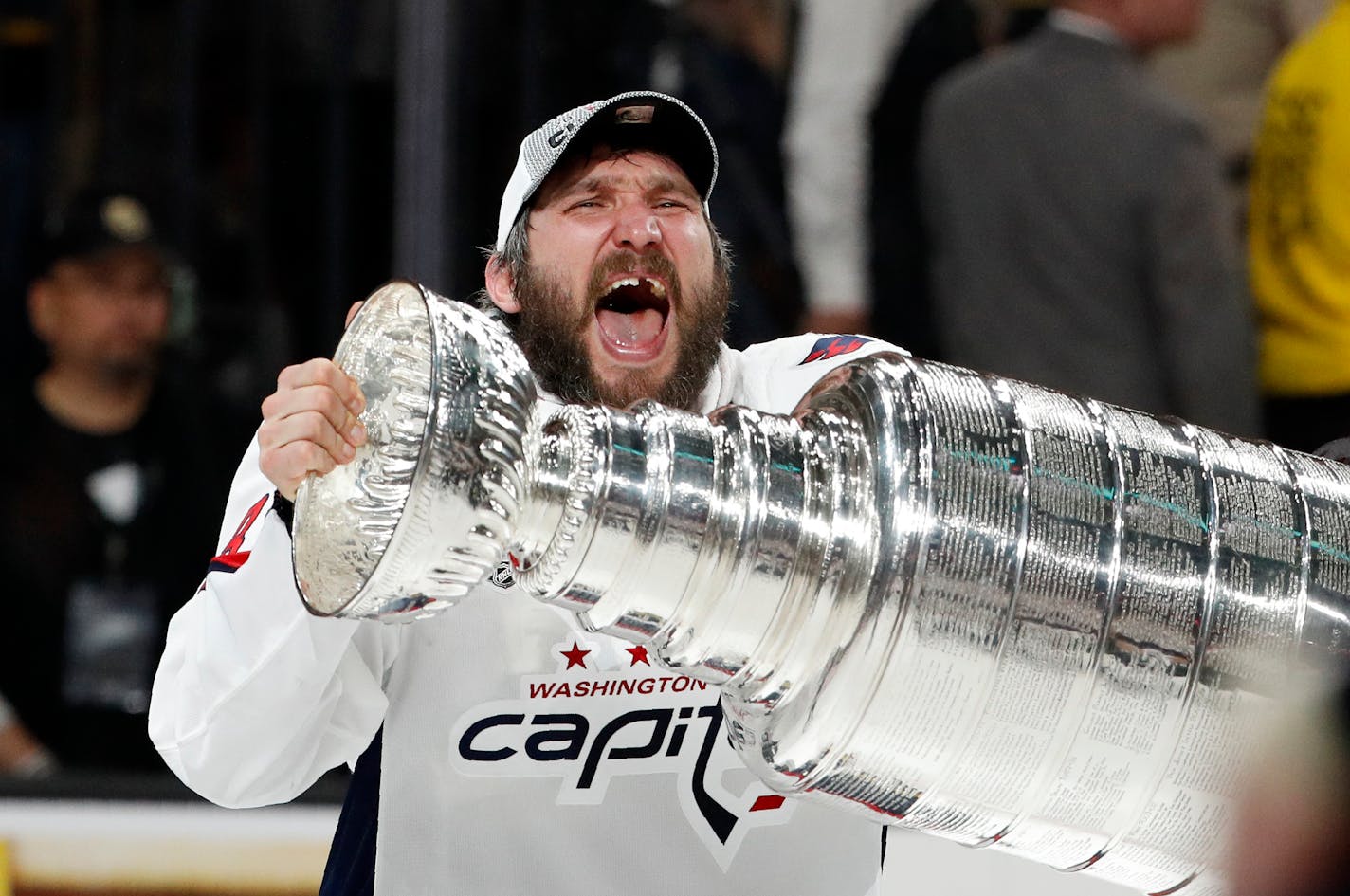 Washington Capitals left wing Alex Ovechkin, of Russia, hoists the Stanley Cup after the Capitals defeated the Golden Knights in Game 5 of the NHL hockey Stanley Cup Finals Thursday, June 7, 2018, in Las Vegas. (AP Photo/John Locher)