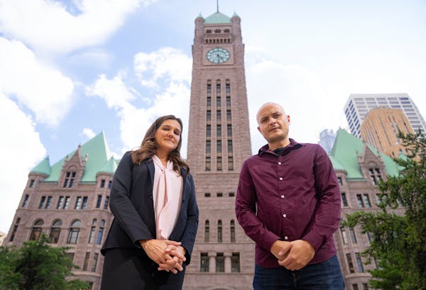 Minneapolis City Council Member Linea Palmisano and Andre Cherkasov outside Minneapolis City Hall. Cherkasov reported suspicious fraud activity while 