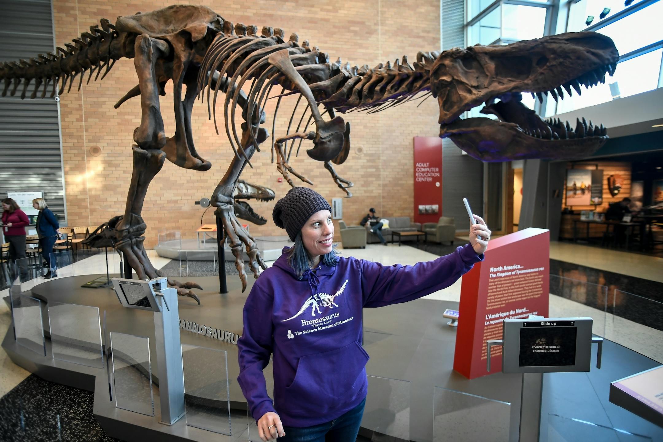 Jill Seifert-Thiel, of Minneapolis, took a selfie with her new Science Museum of Minnesota Brontosaurus hoodie made famous by the Netflix hit, "Stranger Things," Tuesday morning at the Science Museum of Minnesota.