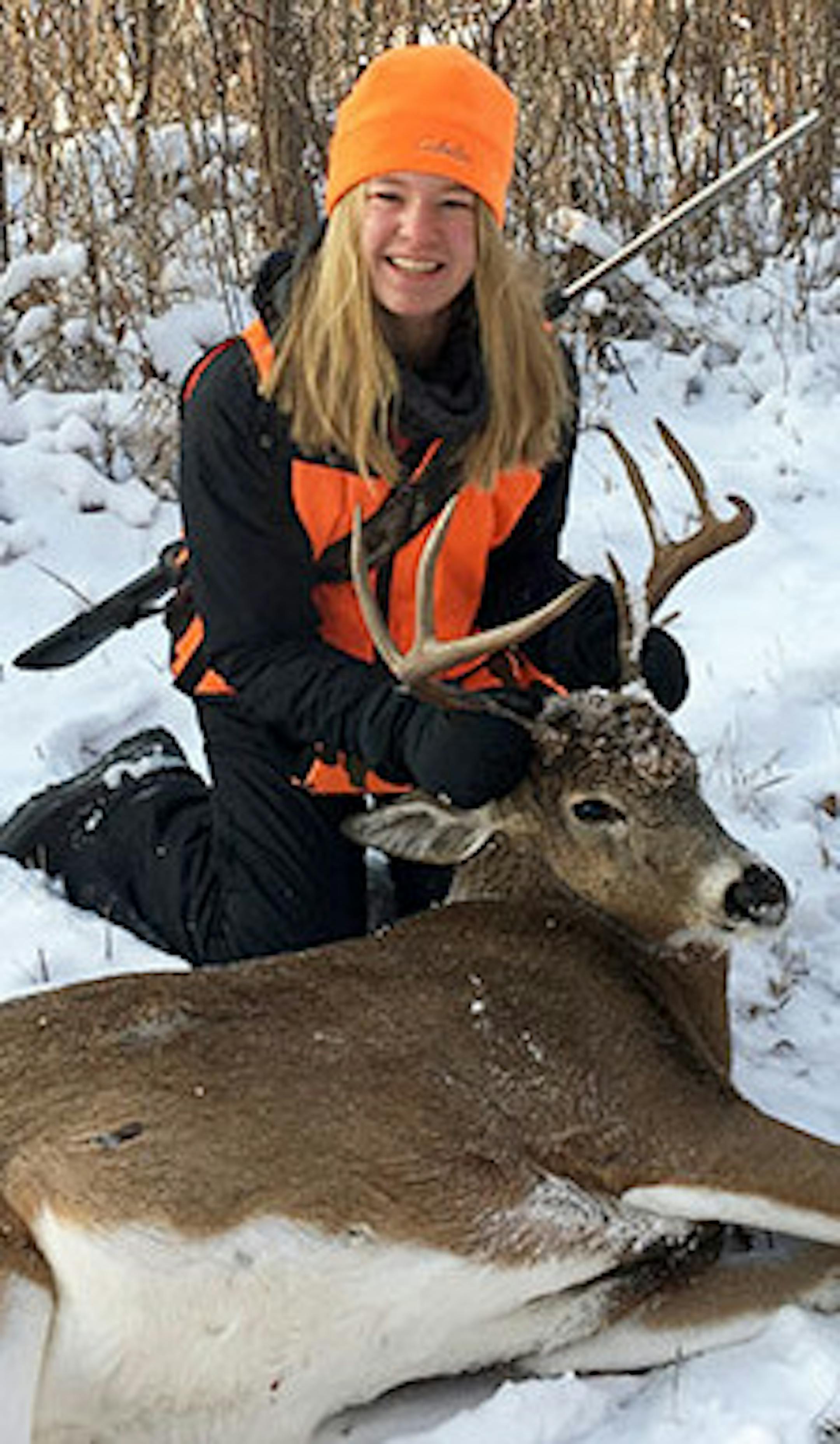 Leah Blomquist, 14, of Plymouth took three long-range shots and made each one count to harvest this buck during the second weekend of Minnesotaís firearm deer season. She was in St. Louis County sitting next to her father, Alan, on his birthday.