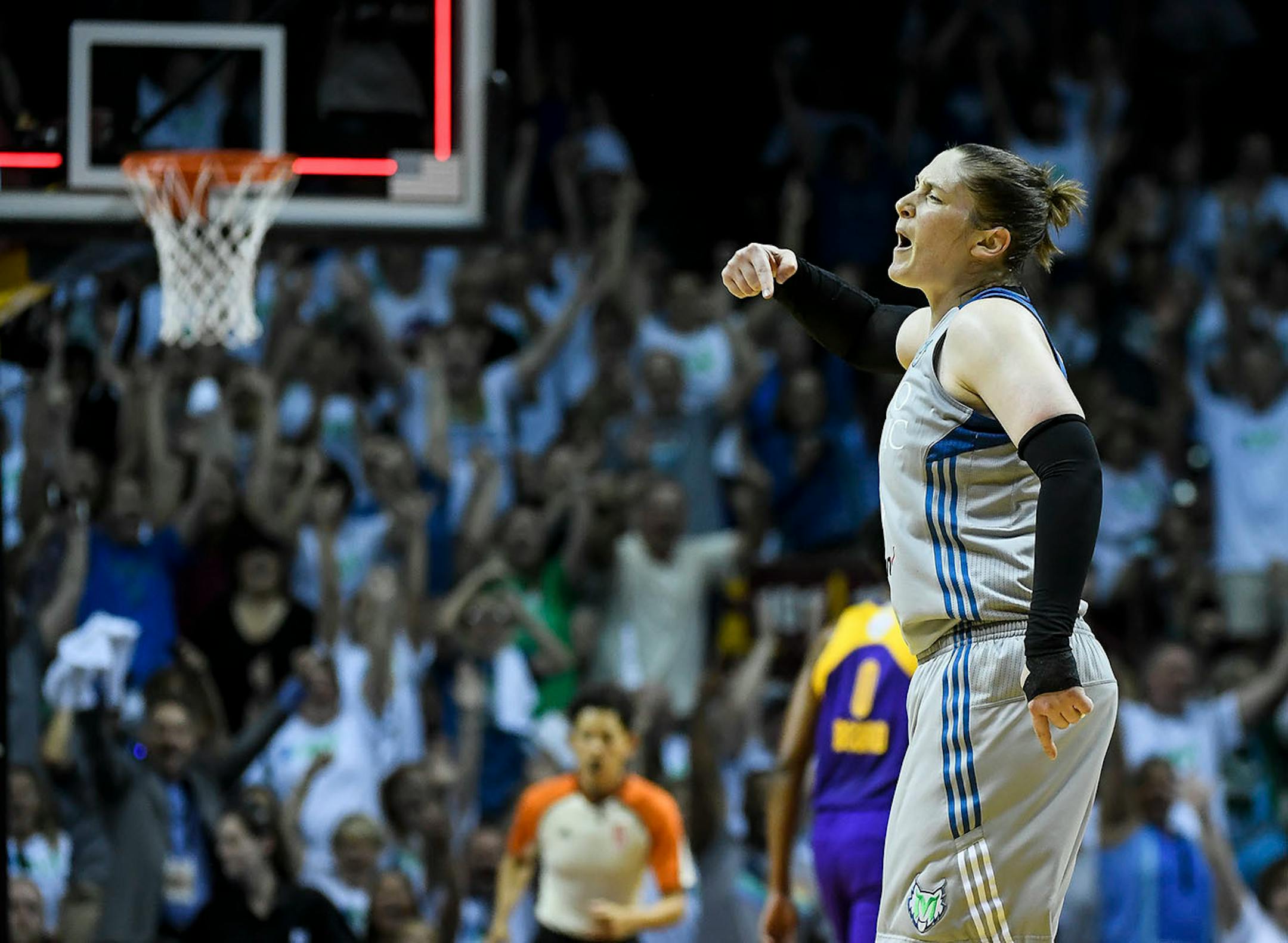 Minnesota Lynx guard Lindsay Whalen (13) celebrated after making what she thought was a buzzer-beating half-court shot to end the first quarter. Officials waved off the shot.