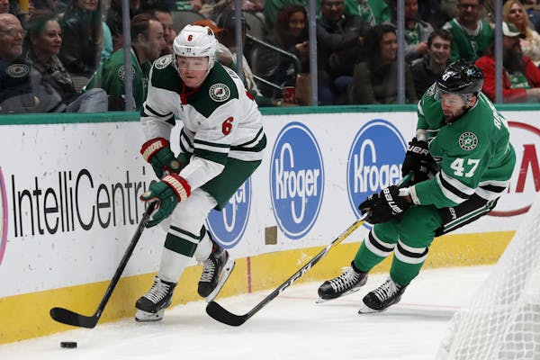 Minnesota Wild center Ryan Donato (6) controls the puck as Dallas Stars right wing Alexander Radulov (47) gives chase in the second period of an NHL h