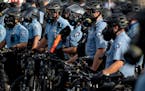 Police gathered en masse as protests continued at Minneapolis’ third police precinct headquarters on May 27, 2020.