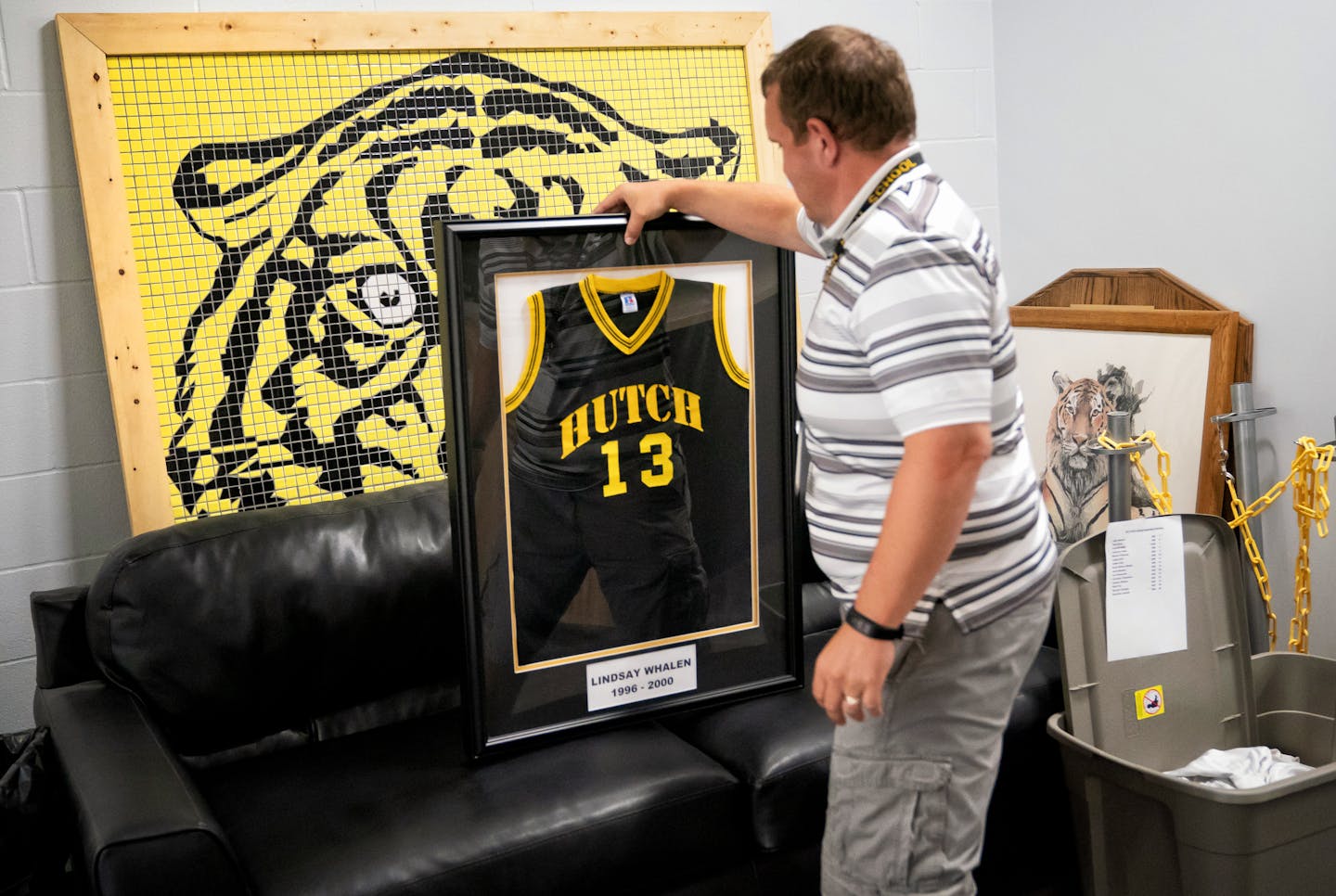 Thayne Johnson, activities director at Hutchinson High School showed off Lindsay Whalen's jersey from when she played for the Hutchinson Tigers. The jersey will be displayed in the newly remodeled school.