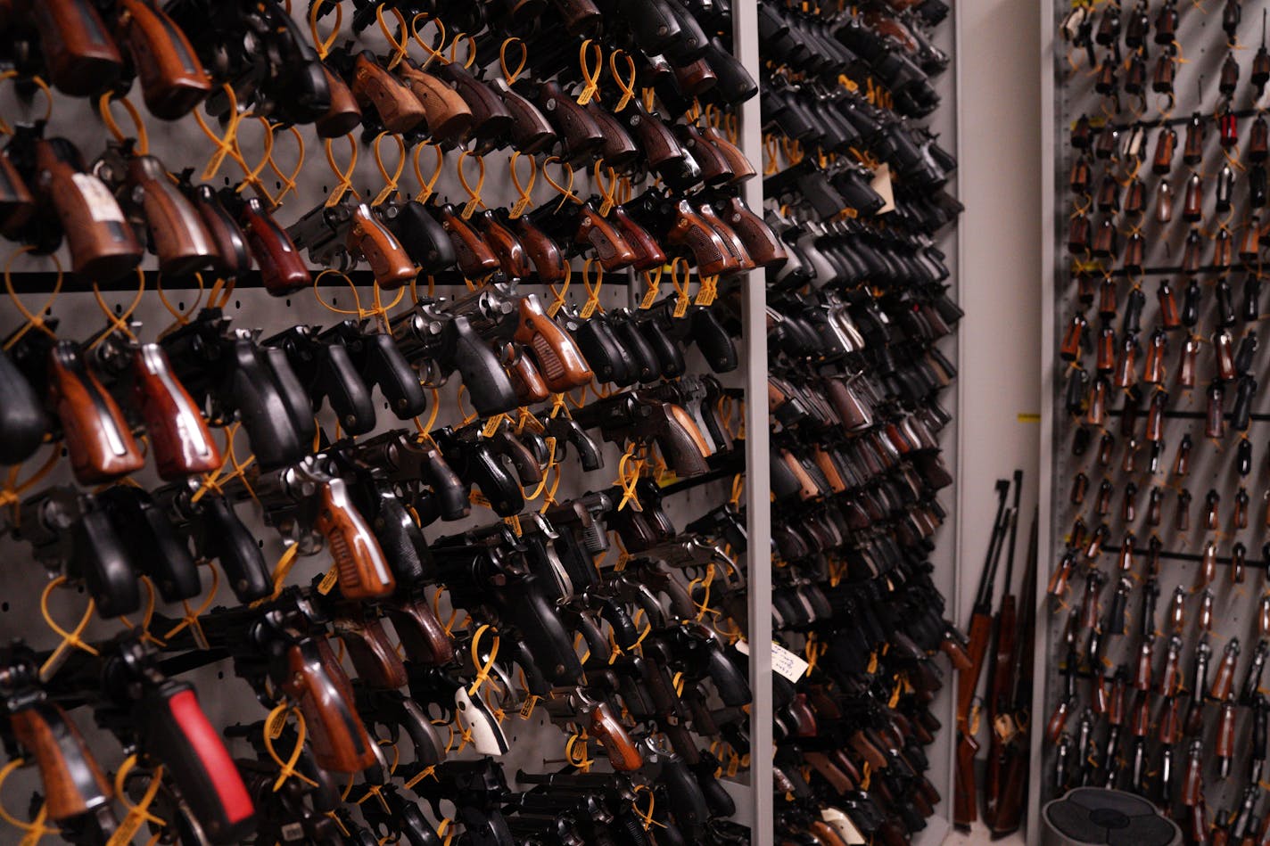 Guns of every make, model, and caliber lined the walls at the BCA's firearm reference library Wednesday. ] ANTHONY SOUFFLE • anthony.souffle@startribune.com Officials from the Bureau of Criminal Apprehension gave a demonstration of how they use NIBIN technology to trace guns to bullets Wednesday, Nov. 6, 2019 at the BCA office building in St. Paul, Minn. NIBIN is a national database of digital images of spent bullets and cartridge cases either found at crime scenes or test-fired by law enforceme