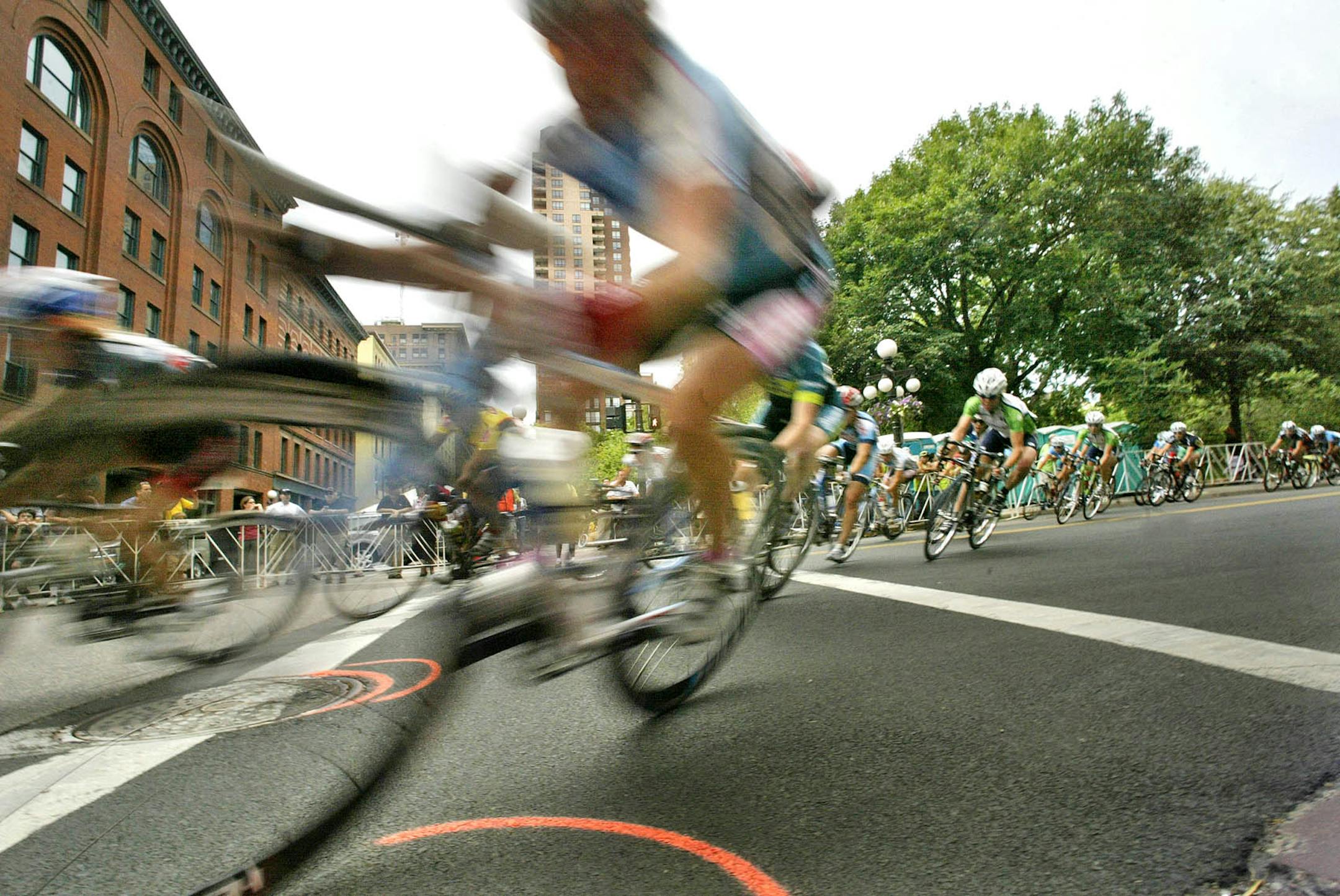 The asphalt is never far away when professional cyclists take to the streets during the Great River Energy Bicycle Festival.