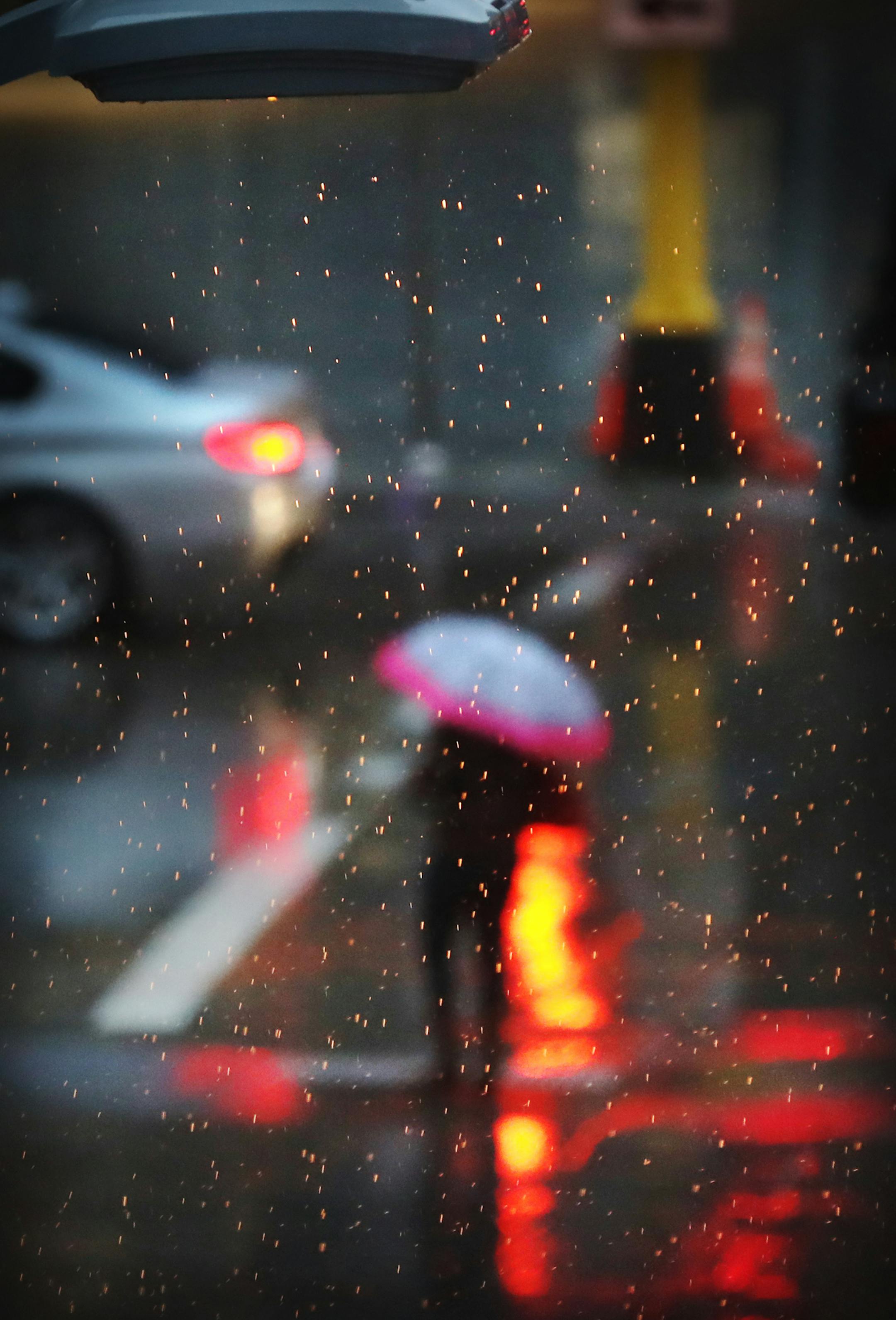 A street light illuminates steady rain falling Wednesday, April 26, 2017, in downtown Minneapolis, MN.] DAVID JOLES ï david.joles@startribune.com Steady, cold rain Wednesday