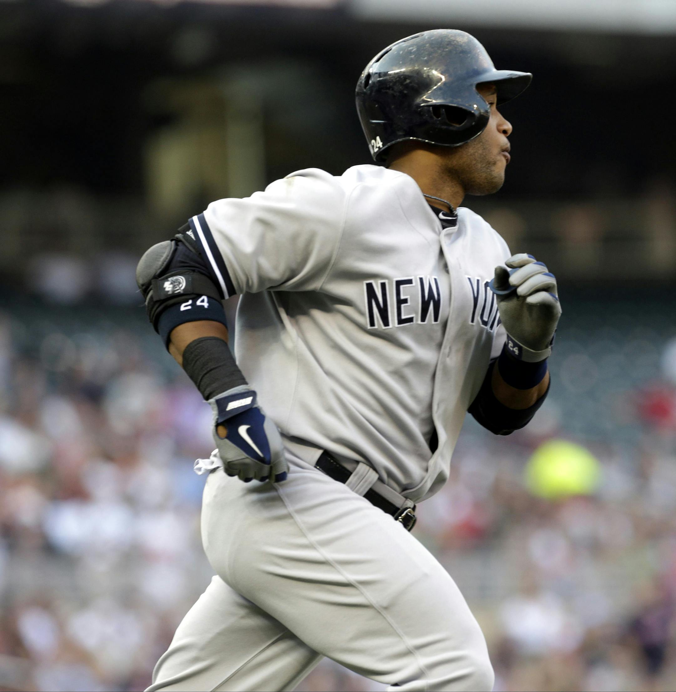 New York Yankees' Robinson Cano heads to first on a solo home run off Minnesota Twins pitcher Scott Diamond in the first inning of a baseball game, Monday, July 1, 2013, in Minneapolis. (AP Photo/Jim Mone)