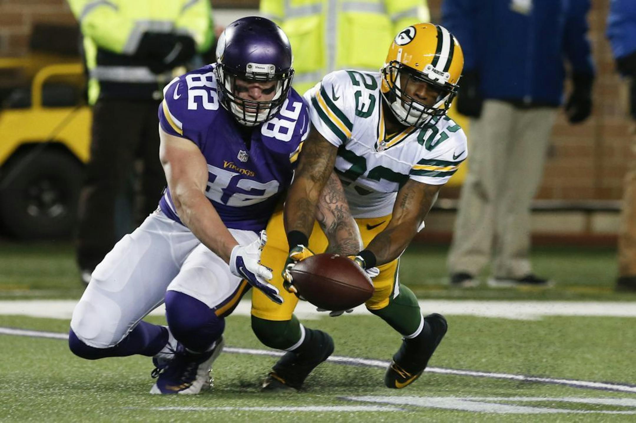 FILE - In this Sunday, Nov. 22, 2015, file photo, Green Bay Packers cornerback Damarious Randall (23) breaks up a pass to Minnesota Vikings tight end Kyle Rudolph (82) during the second half of an NFL football game in Minneapolis. The Vikings and Packers are on course to play each other in back-to-back games, in Week 17 and in the wild card round.