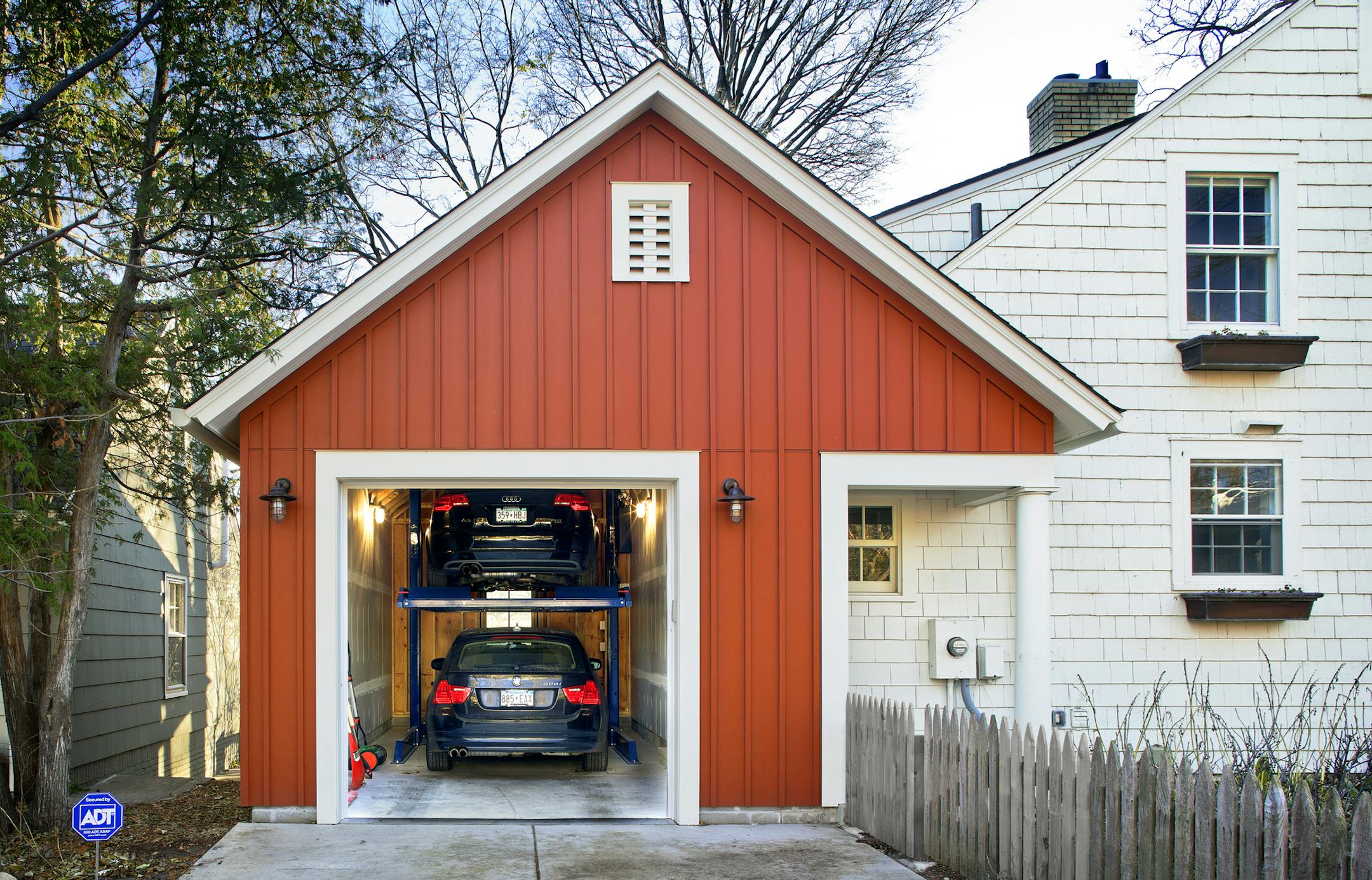 The city lot wasn&#x2019;t large enough for a two-car garage, so architect Todd Hansen designed an attached garage that holds two cars stacked on top of each other.