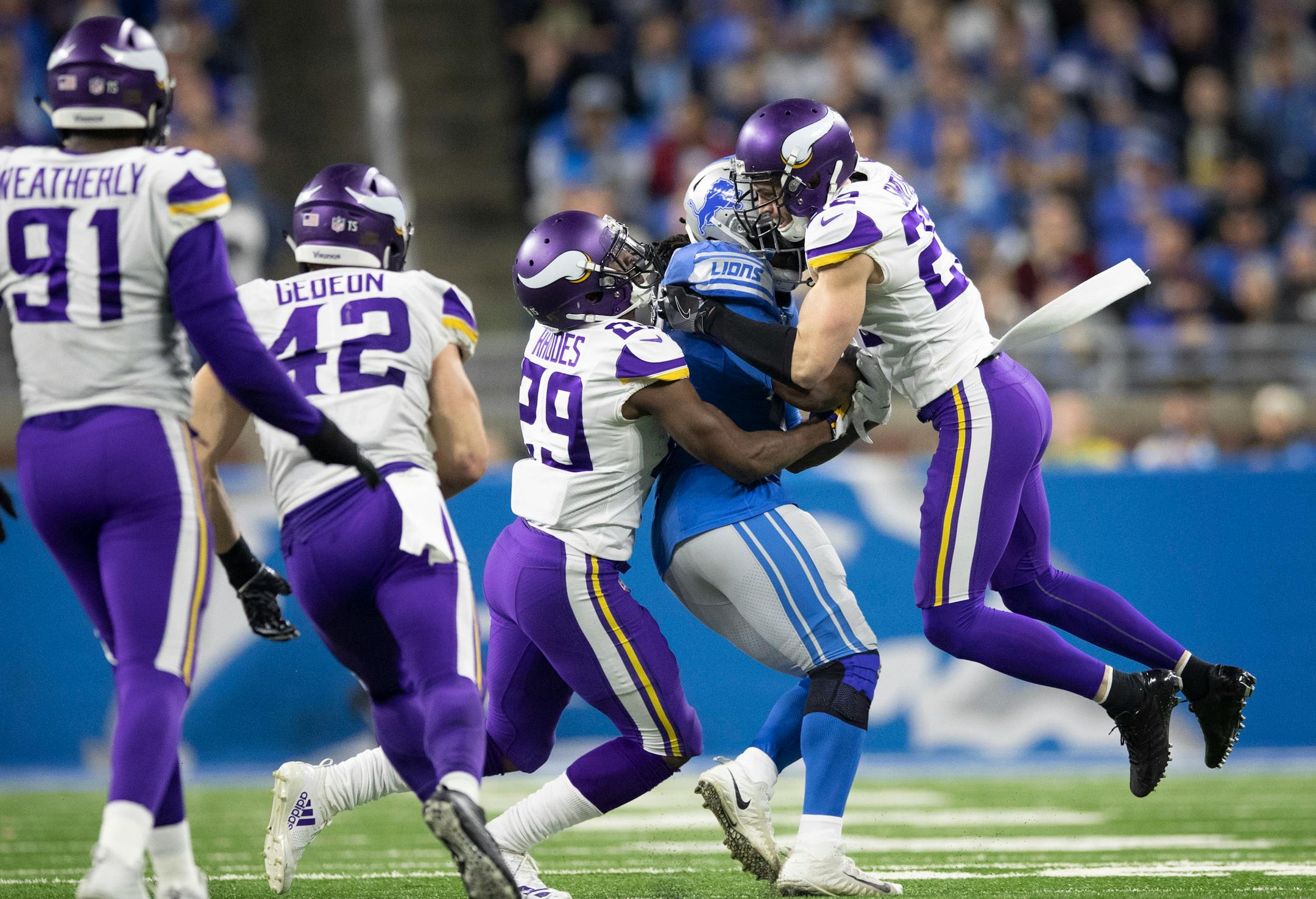 Vikings cornerback Xavier Rhodes (29) and safety Harrison Smith (22) tackled Lions running back LeGarrette Blount on a fourth-quarter run at Ford Field on Sunday.