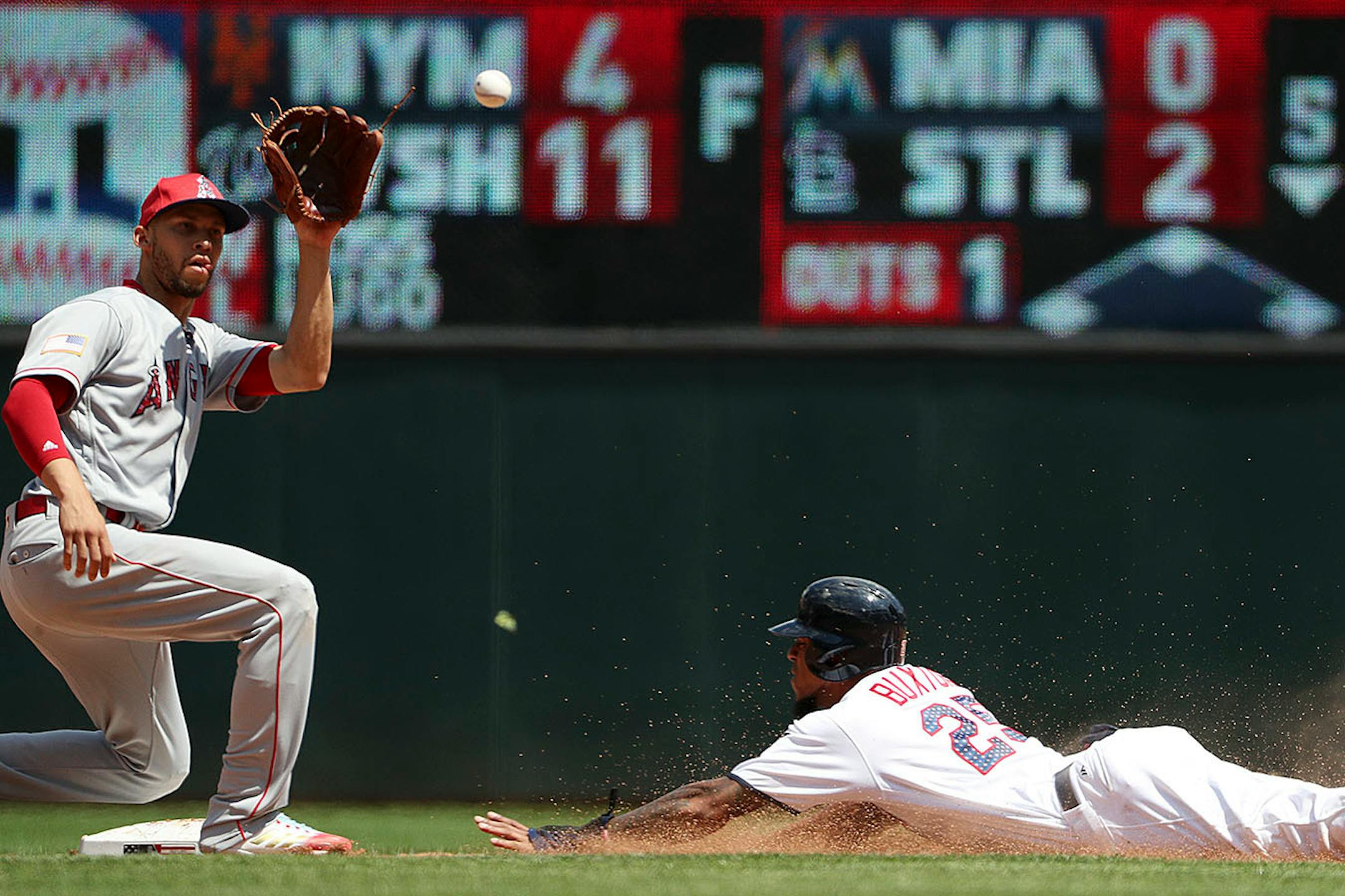 Minnesota Twins center fielder Byron Buxton (25) stole second base as Los Angeles Angels shortstop Andrelton Simmons (2) waited for the throw in the fifth inning.
