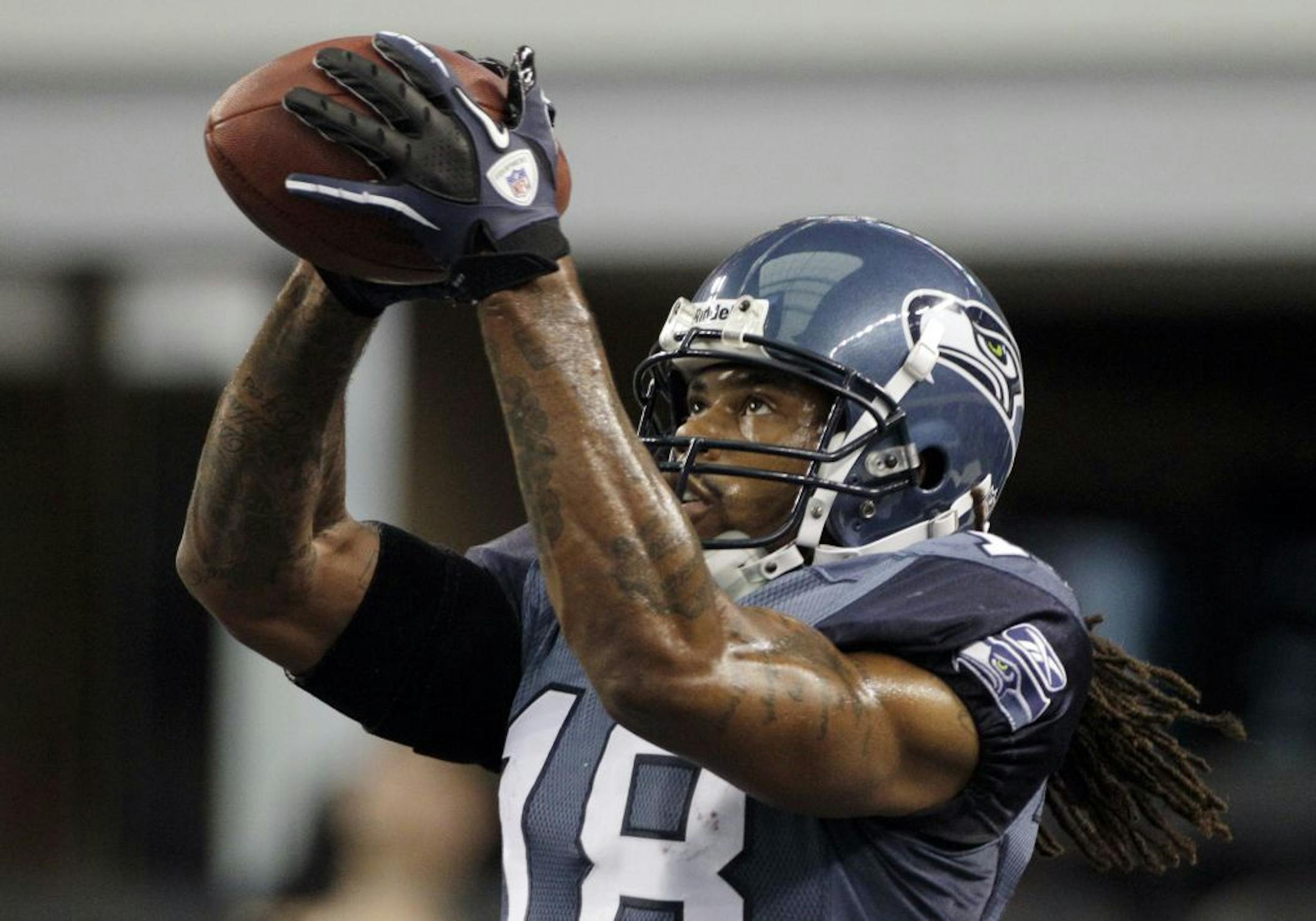 Seattle Seahawks wide receiver Sidney Rice catches the ball before an NFL football game against the Dallas Cowboys Sunday, Nov. 6, 2011, in Arlington, Texas.