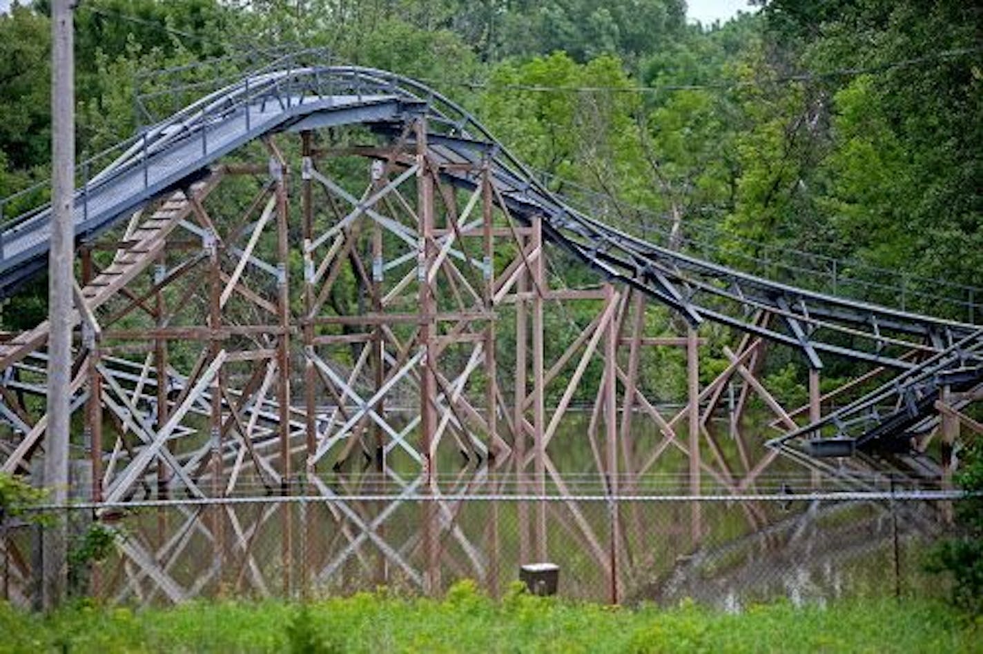 The Excalibur roller coaster remained submerged in flood waters at Valleyfair Wednesday, June 25, 2014 in Shakopee.