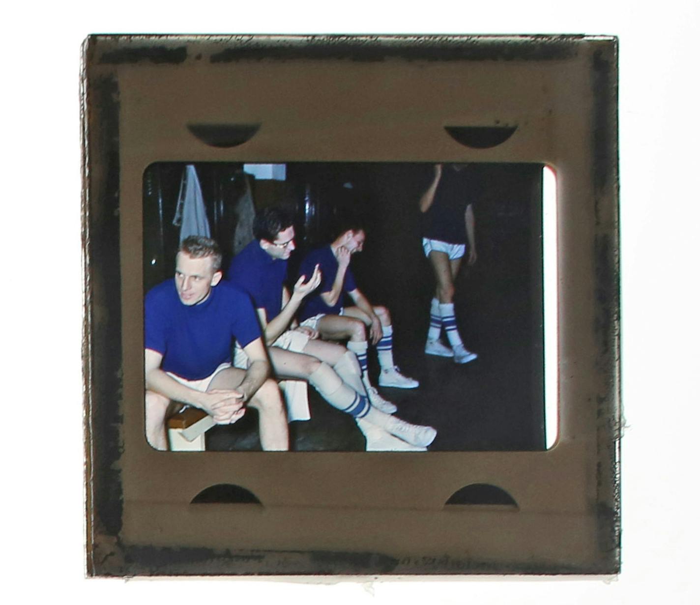 From left: Whitey Skoog, George Mikan and Vern Mikkelsen in the locker room.