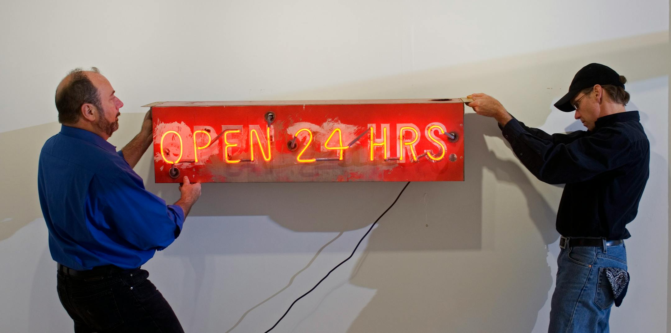 Howard Christopherson, left, owner of Icebox Gallery, helps photographer Dan Havel install his part of the retrospective exhibit for the show that will open Saturday and be part of his 20th anniversary celebration. "He's persevered in the business despite many odds against him," said MCP artistic director George Slade.