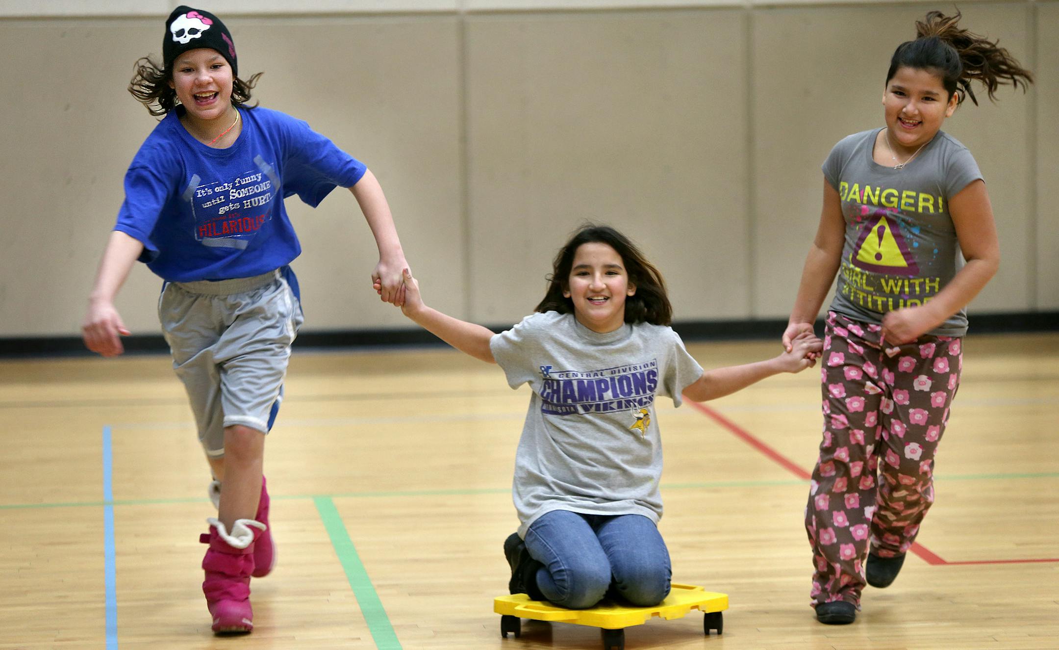 Trinity Oppegard, 10, left, Ashauna Weaver, 10, center and Asondra Weaver, 8, spent their day playing indoors at the North Dale Community Center Monday, January 27, 2014 in St. Paul, MN. The girls said they would prefer going to school at Chelsea Heights Elementary School than stay home. (ELIZABETH FLORES/STAR TRIBUNE) ELIZABETH FLORES &#x2022; eflores@startribune.com