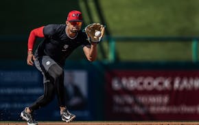 Twins third baseman Royce Lewis fields a grounder during spring training in Fort Myers, Fla.