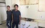 Santiago Garnica and Erick Flores stood in their bare south Minneapolis apartment. Stephen Frenz&#x2019;s workers tore out appliances including the ki