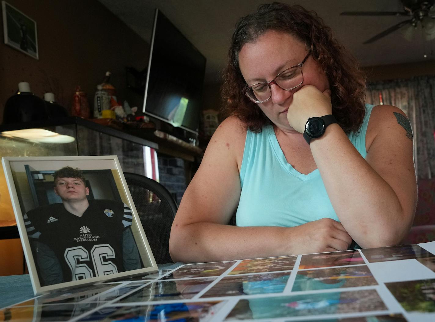 Tabbatha Urbanski looked at photos on a posterboard of her son Seth Carlson inside her home in Bloomington, Minn., on Friday, June 16, 2023.