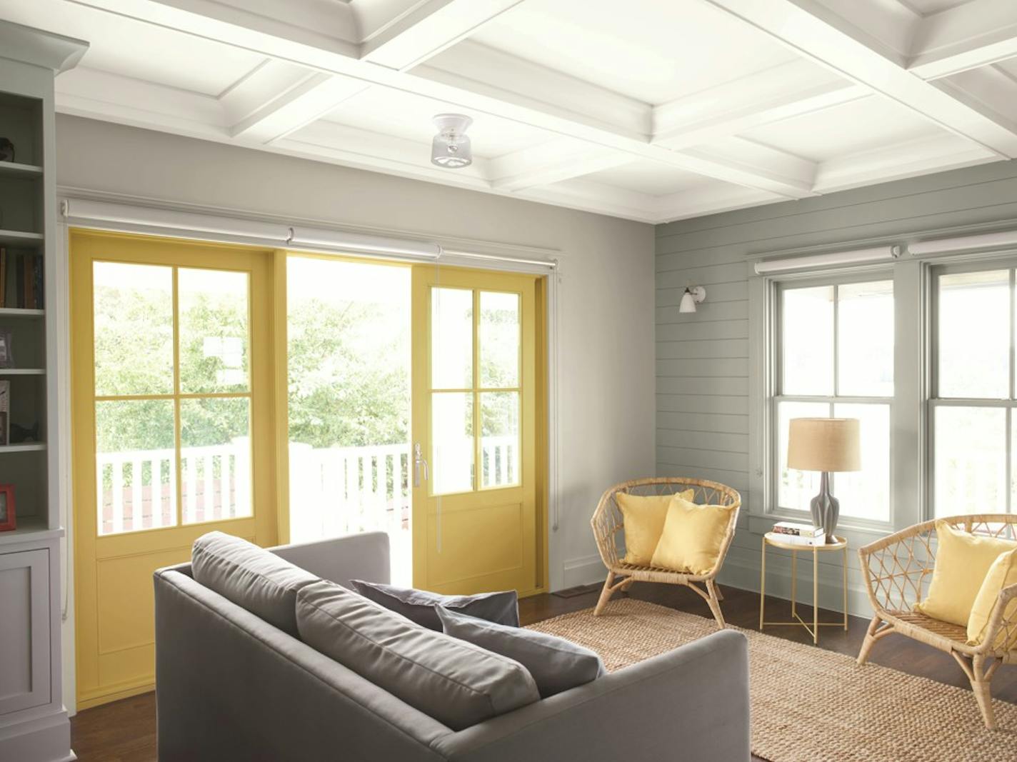 The left-hand wall of this sitting room is painted with Benjamin Moore's Gray Owl OC-52; the right wall is done with Metropolitan AF-690; the ceiling is painted in White Heron OC-57; and the doors are done in Marblehead Gold HC-11. MUST CREDIT: Benjamin Moore