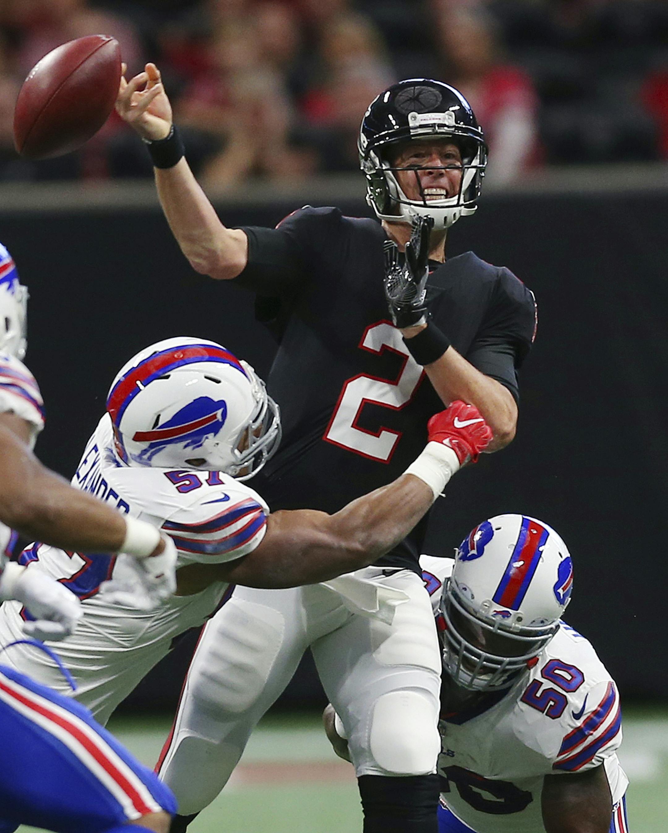 Buffalo Bills outside linebacker Ramon Humber (50) and Buffalo Bills outside linebacker Lorenzo Alexander (57) pressure Atlanta Falcons quarterback Matt Ryan (2) during the first half of an NFL football game, Sunday, Oct. 1, 2017, in Atlanta. (AP Photo/John Bazemore)