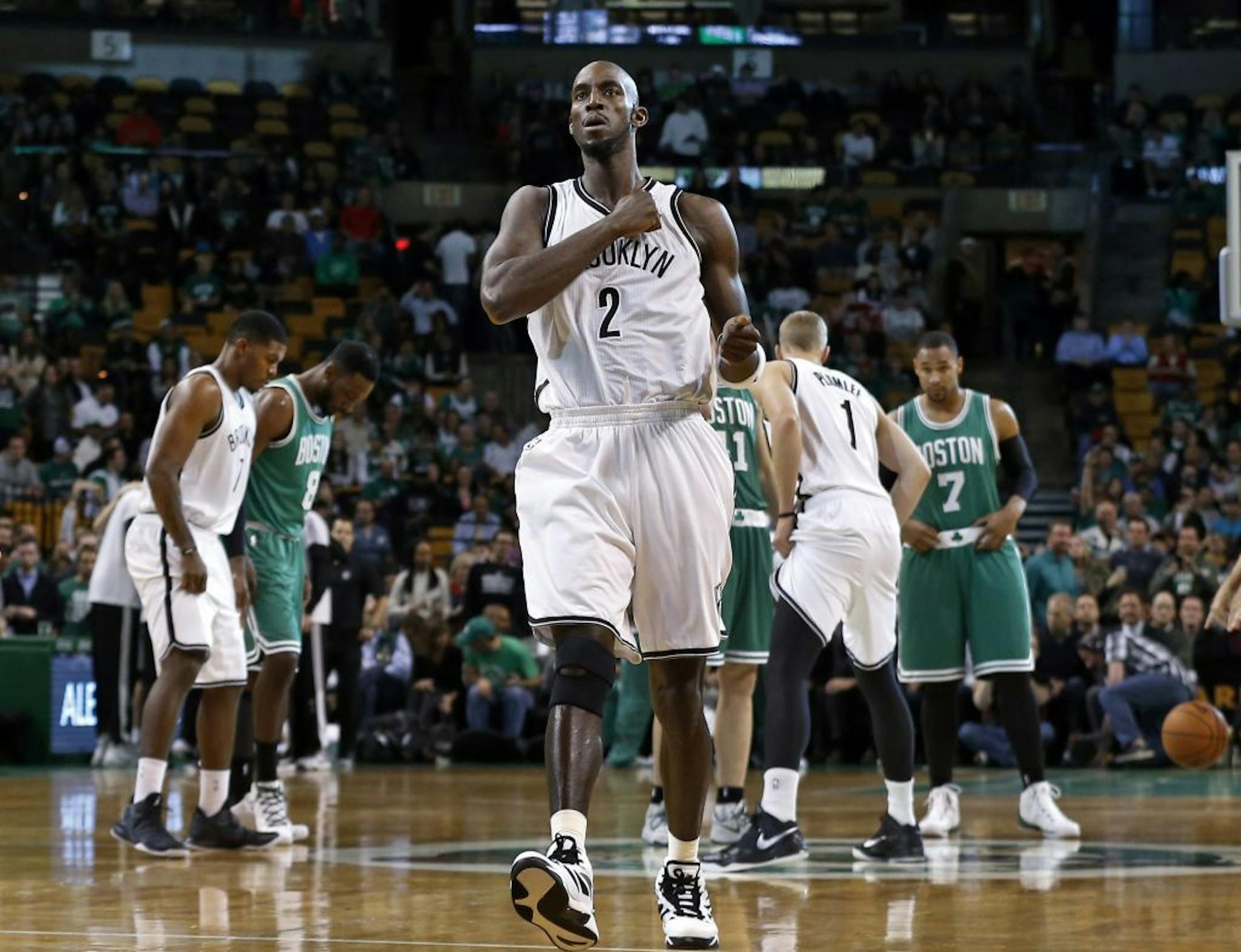 Brooklyn Nets center Kevin Garnett (2) pounds his chest right before an NBA basketball game against the Boston Celtics in Boston, Wednesday, Oct. 29, 2014.