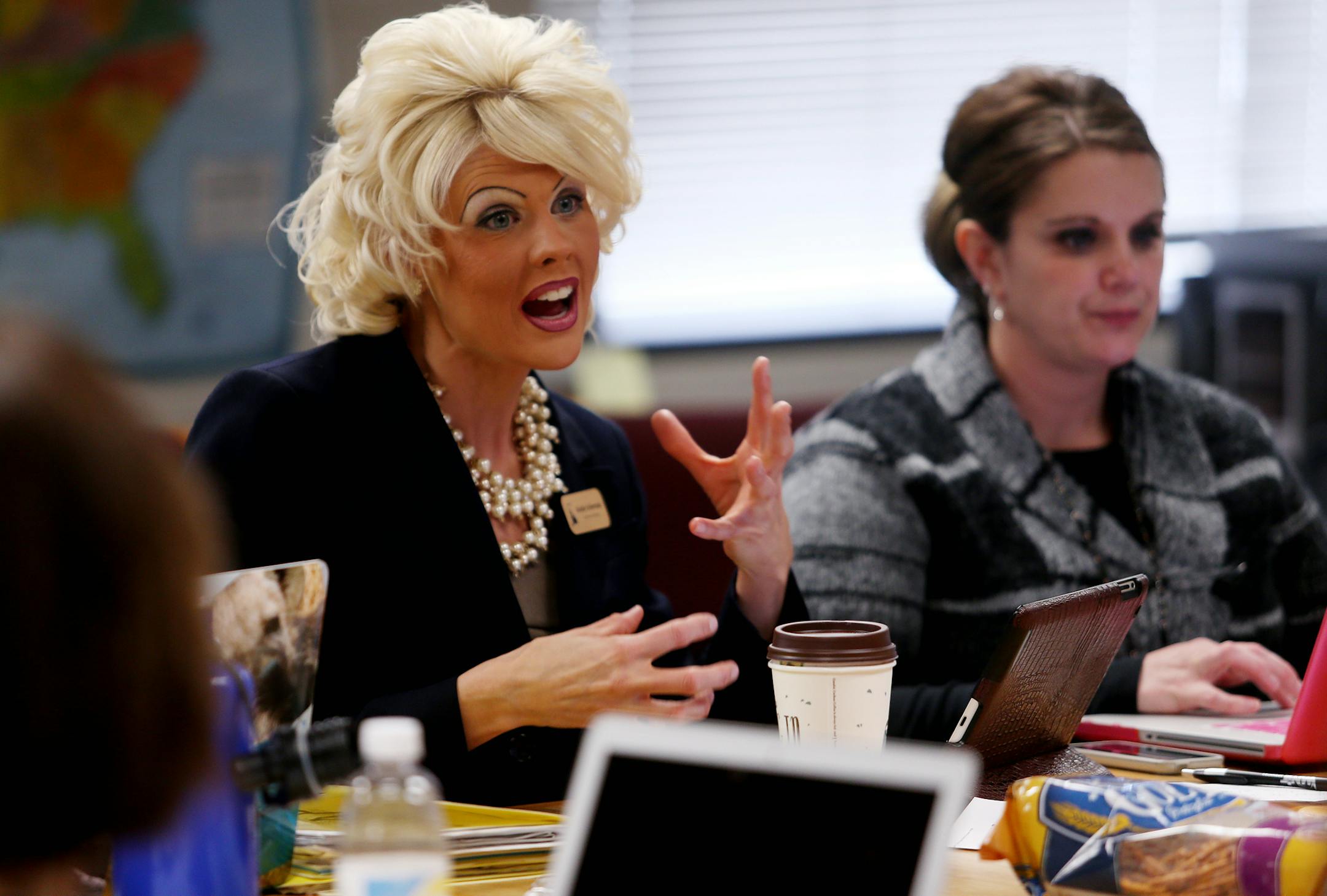 Literacy Specialist Kristin Scherman, left, spoke with teachers at Garlough Elementary, which was dubbed a “Focus” school. .