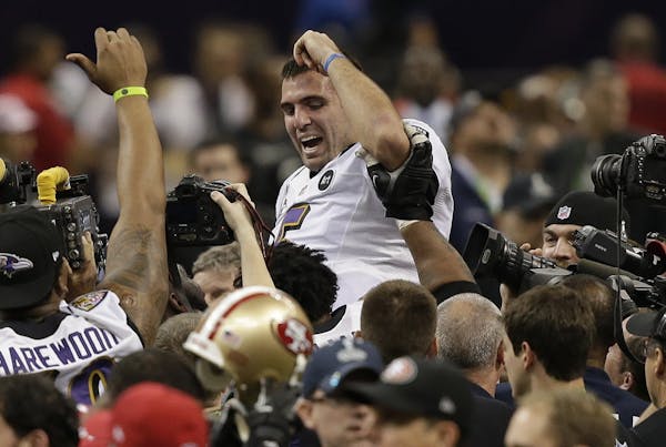Baltimore quarterback Joe Flacco (5) was lifted into the air by teammates after defeating San Francisco 34-31 in Super Bowl XLVII.